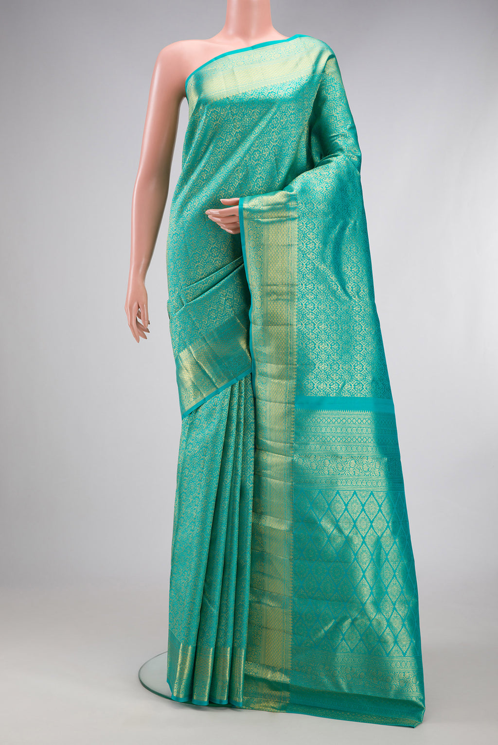 Sky Blue Kanchipuram Silk Saree with Zari Brocade on the body and Zari Border.  displayed on a mannequin