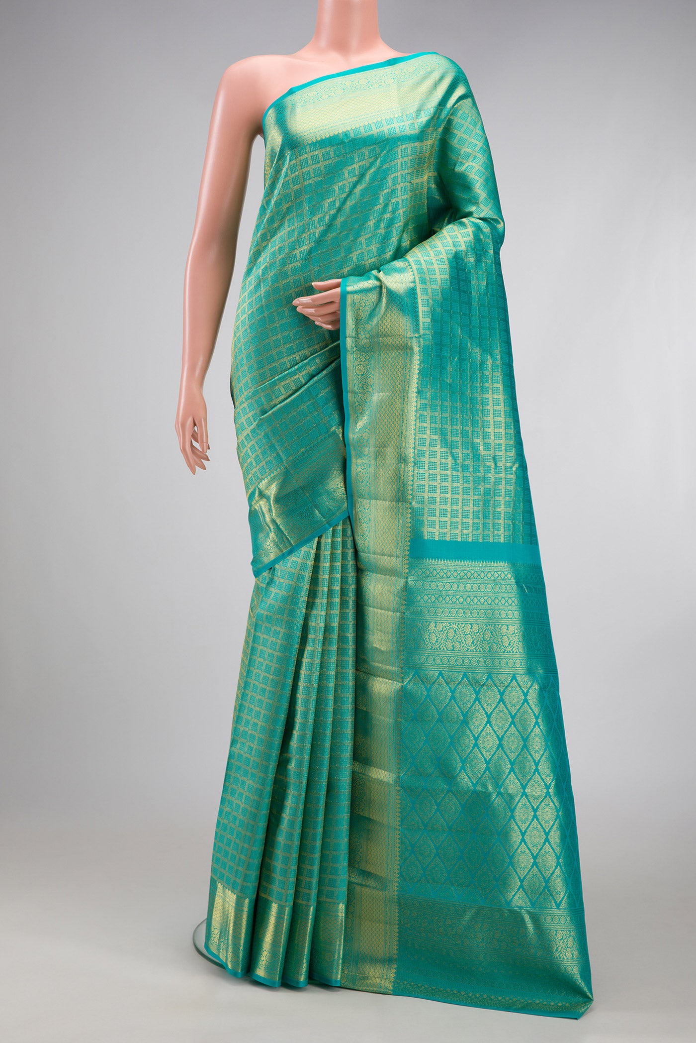 Sky Blue Kanchipuram Silk Saree with Zari Brocade on the body and Zari Border.  displayed on a mannequin