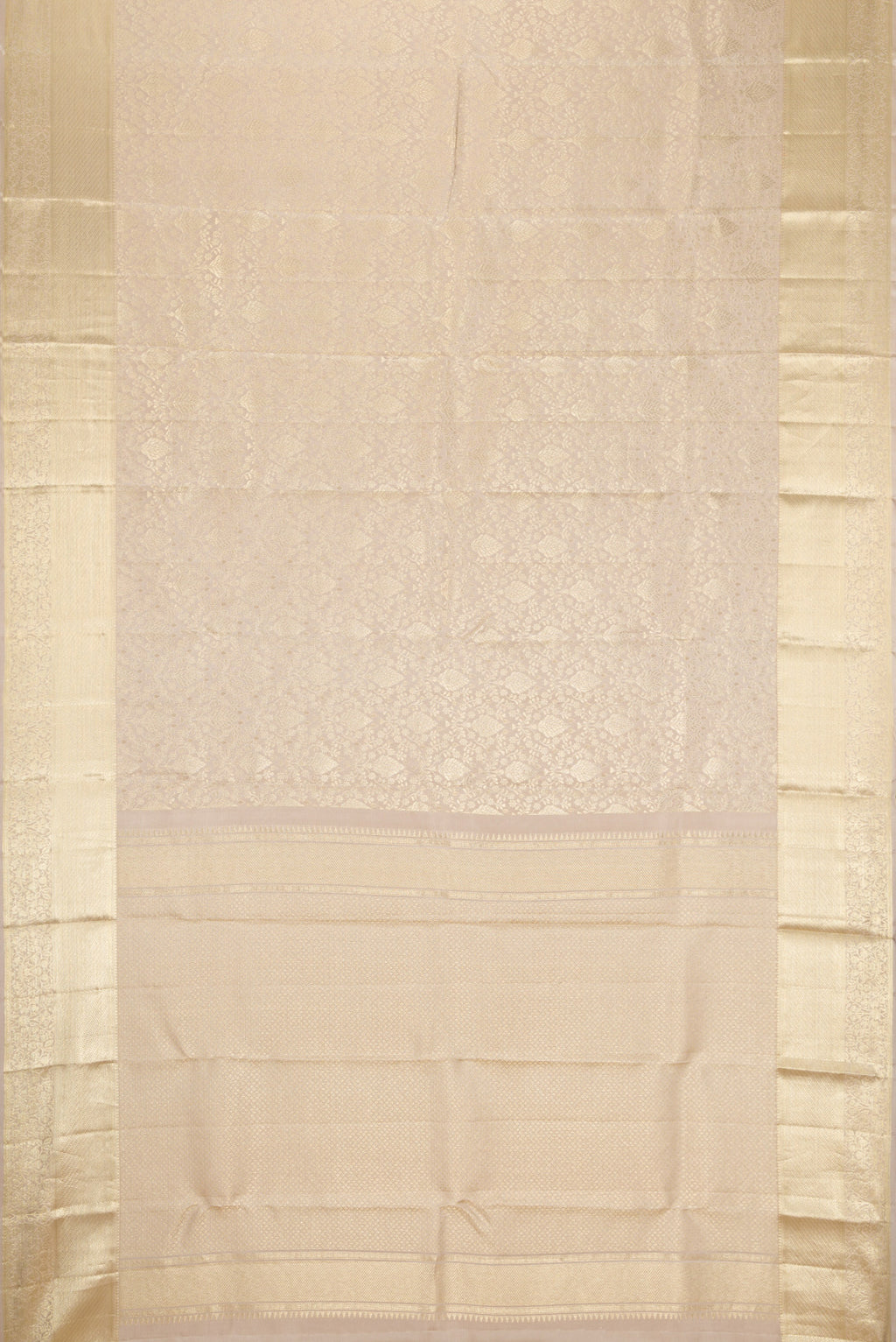Flat view of Off White Kanchipuram Silk Saree with Zari Brocade on the body and Zari Border. 
