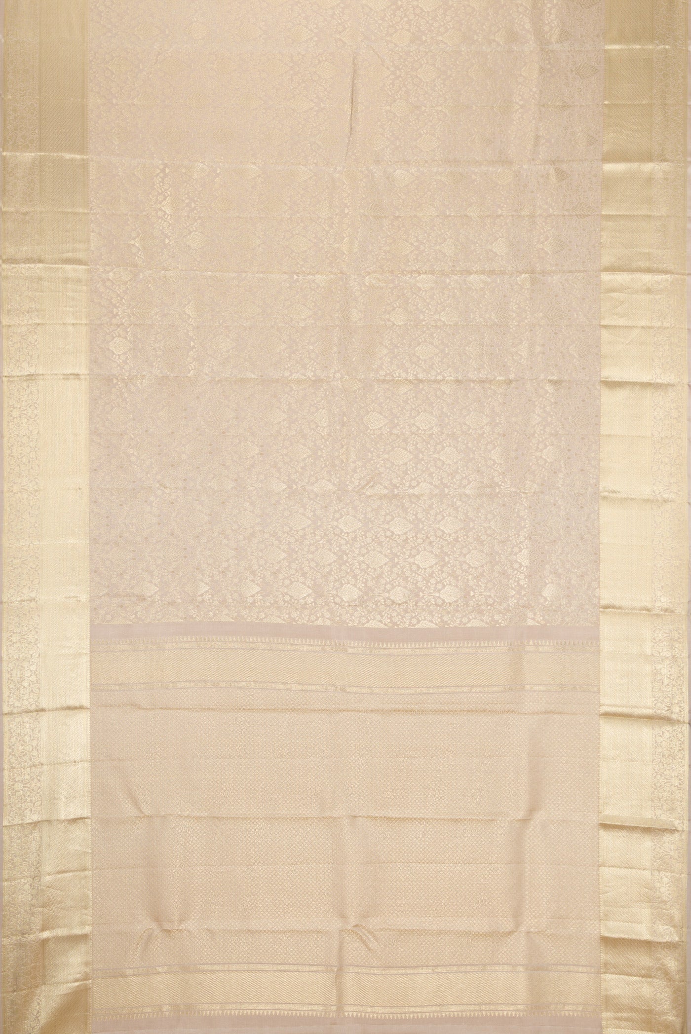 Flat view of Off White Kanchipuram Silk Saree with Zari Brocade on the body and Zari Border. 