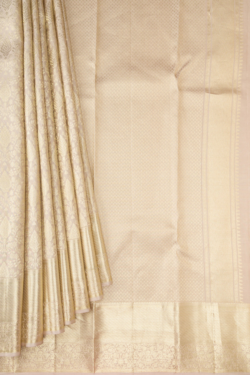Pleats and pallu of Off White Kanchipuram Silk Saree with Zari Brocade on the body and Zari Border. 