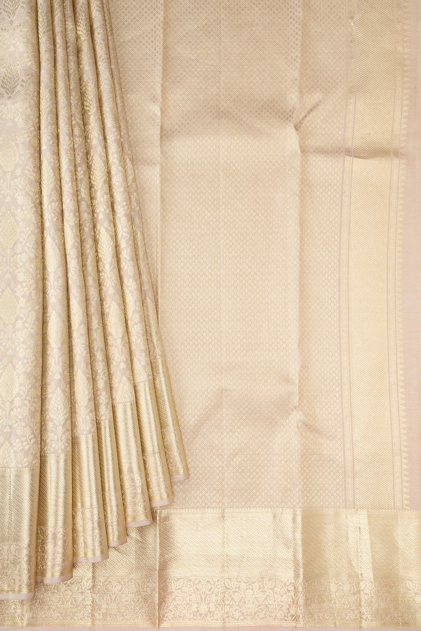 Pleats and pallu of Off White Kanchipuram Silk Saree with Zari Brocade on the body and Zari Border. 