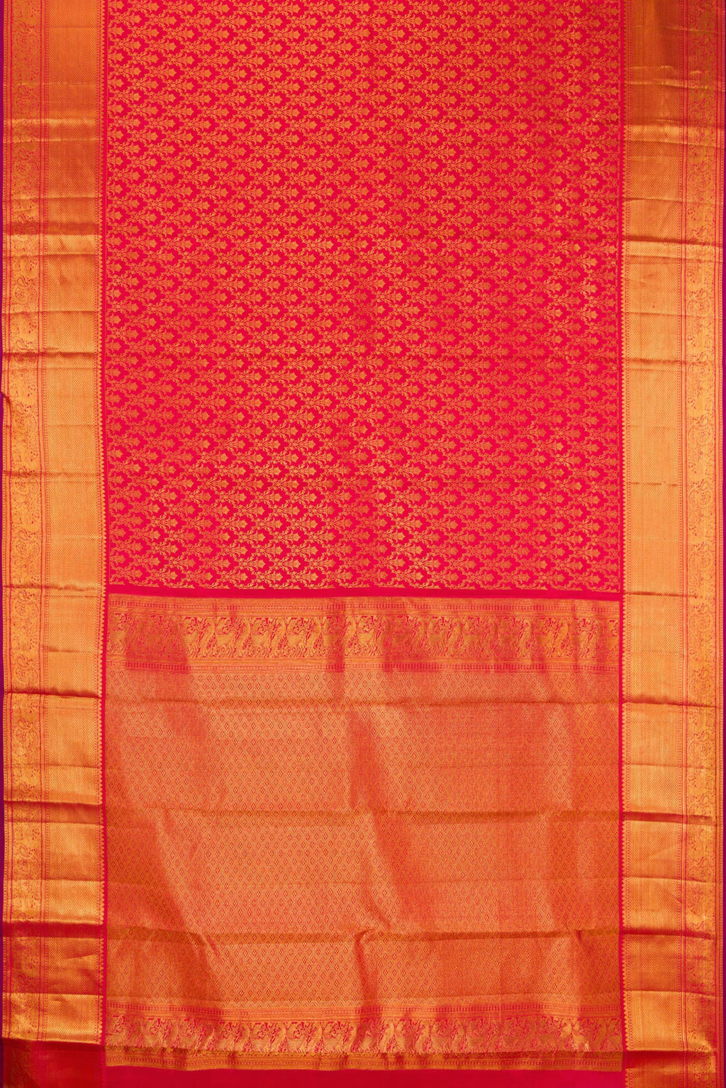 Flat view of Red Kanchipuram Silk Saree with Zari Brocade on the body and Zari Border. 