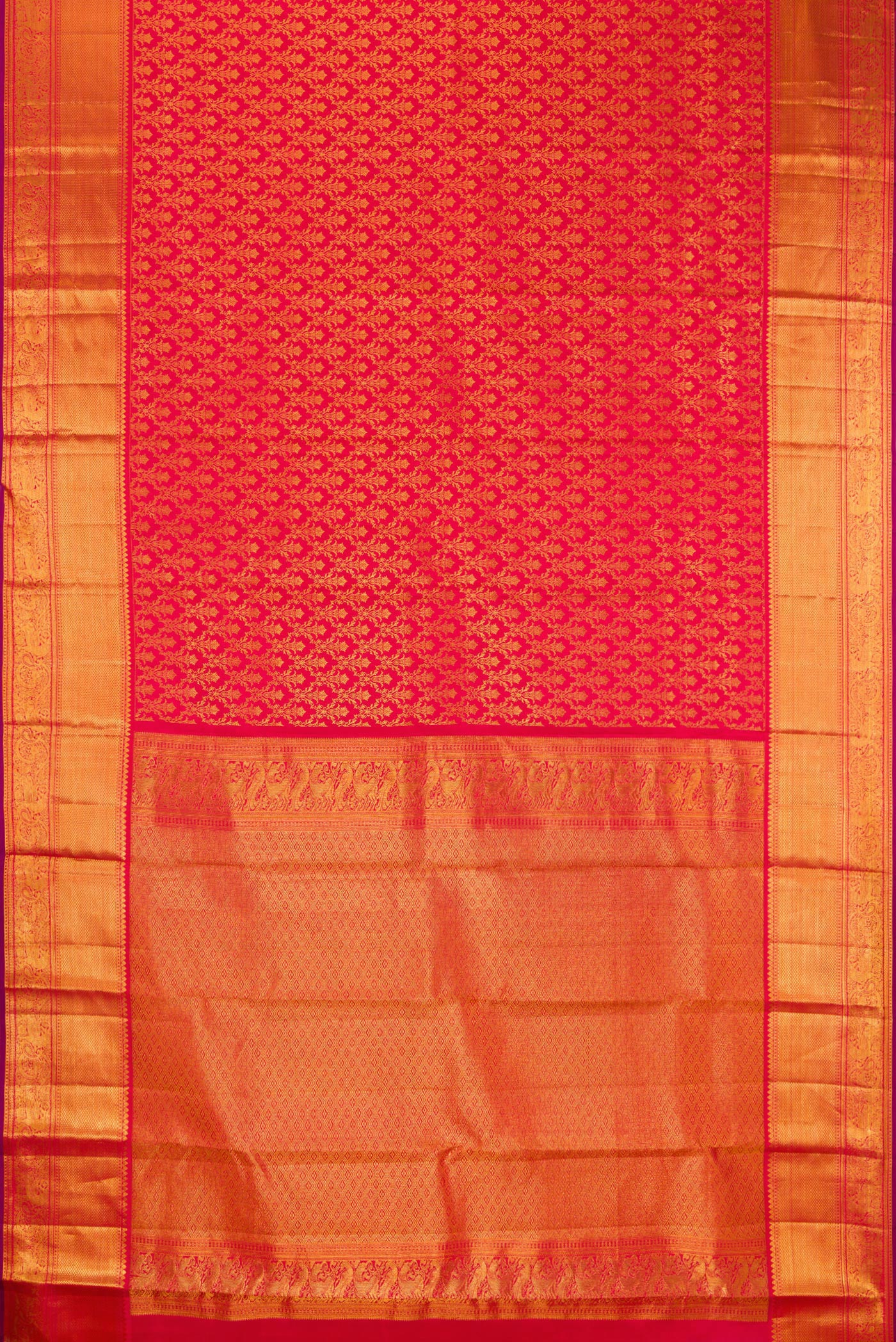 Flat view of Red Kanchipuram Silk Saree with Zari Brocade on the body and Zari Border. 