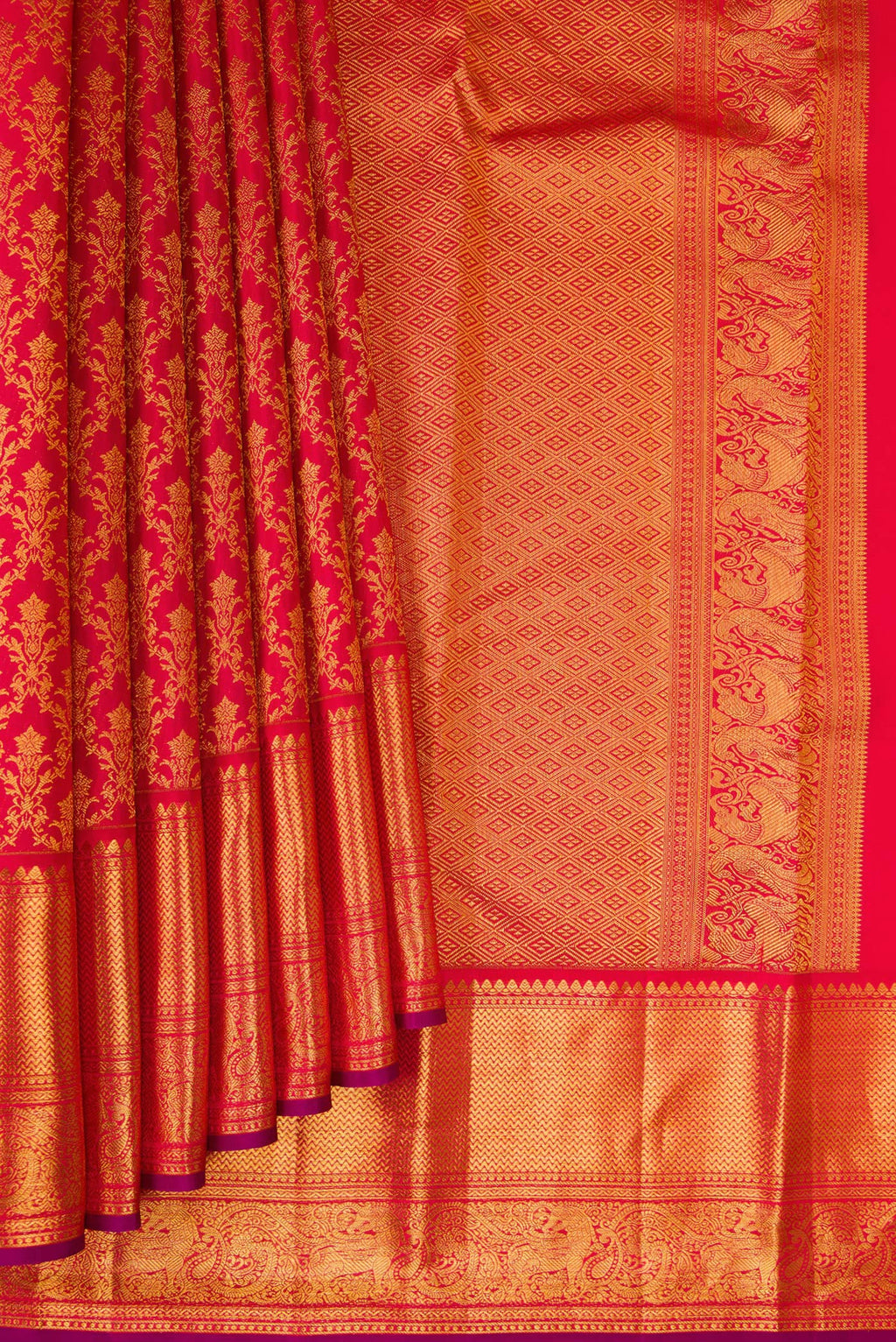 Pleats and pallu of Red Kanchipuram Silk Saree with Zari Brocade on the body and Zari Border. 