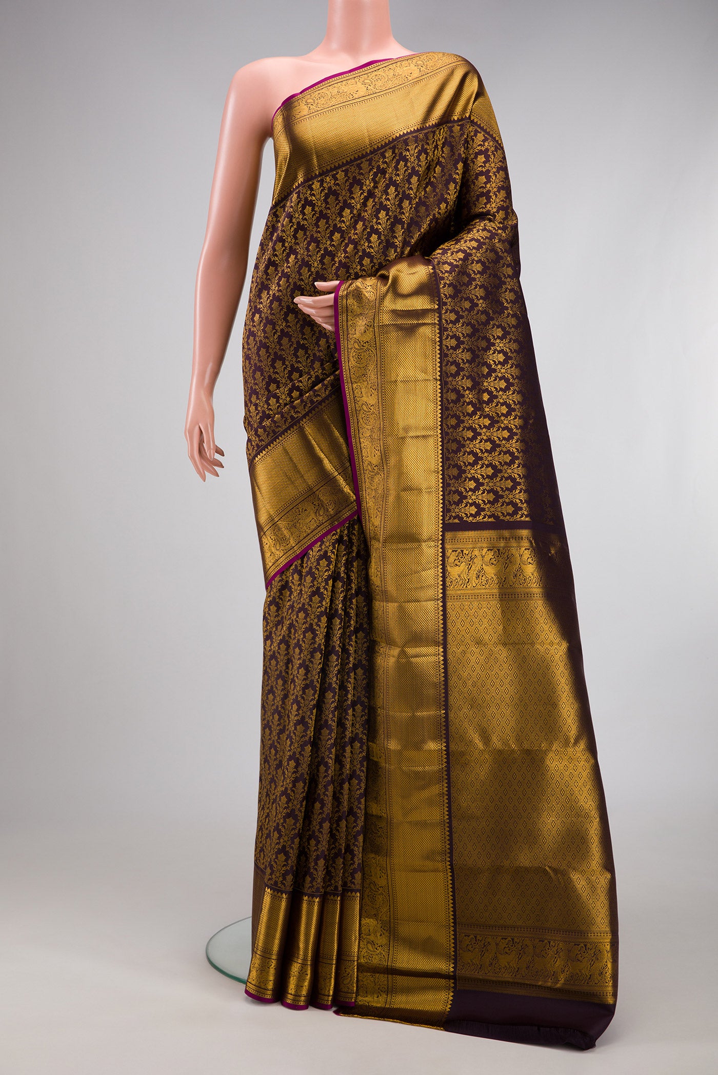 Coffee Brown Kanchipuram Silk Saree with Zari Brocade on the body and Zari Border.  displayed on a mannequin