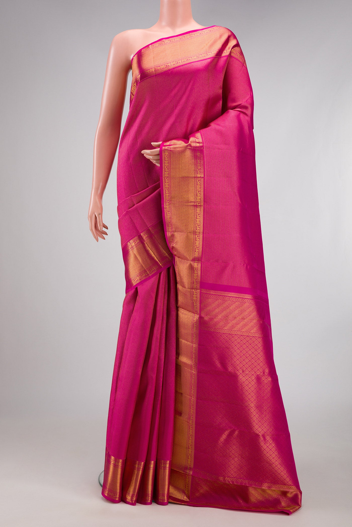 Rani Pink Dual Tone Kanchipuram Silk Saree with Zari Brocade on the body and Zari Border.  displayed on a mannequin
