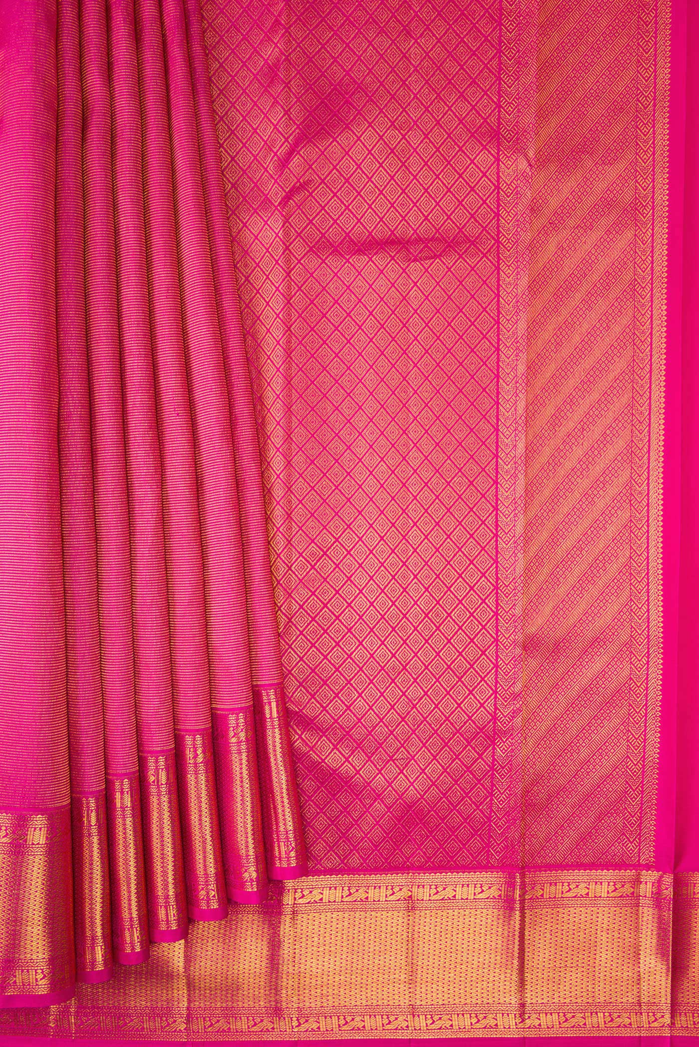 Pleats and pallu of Rani Pink Dual Tone Kanchipuram Silk Saree with Zari Brocade on the body and Zari Border. 