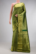 Bottle Green Kanchipuram Silk Saree with Zari Brocade on the body and Zari Border.  displayed on a mannequin