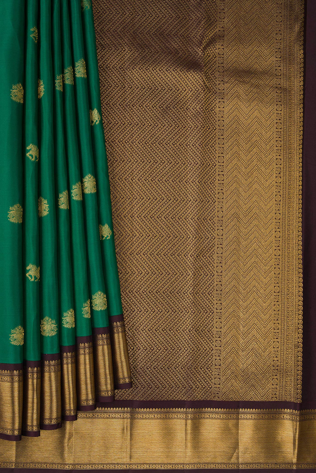 Pleats and pallu of Green Kanjivaram Silk Saree with Zari Butta on the body and Zari Border. 