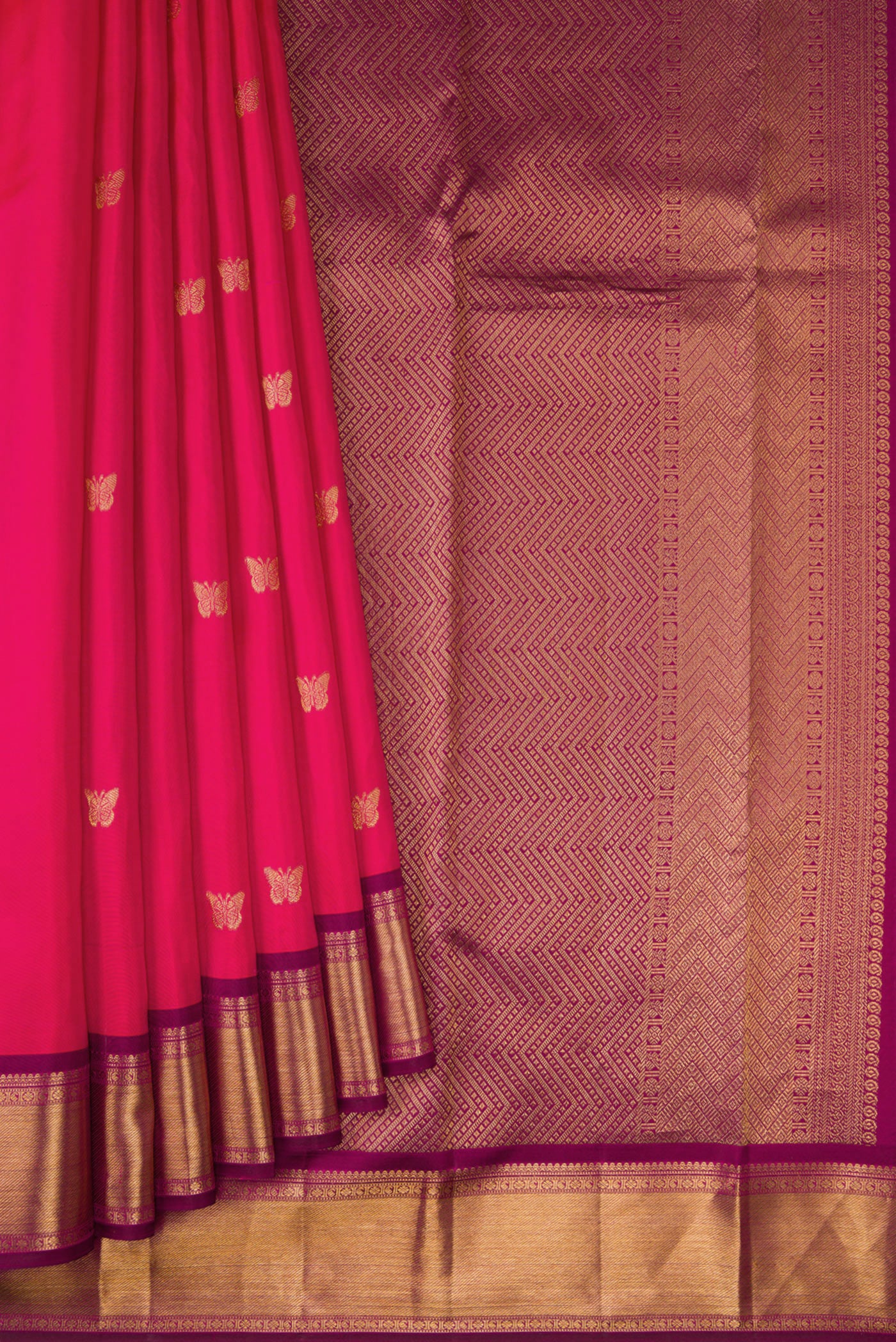 Pleats and pallu of Dark Pink Kanjivaram Silk Saree with Zari Butta on the body and Zari Border. 
