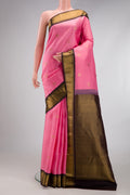 Rose pink Kanchipuram Silk Saree with Zari Butta on the body and Zari Border.  displayed on a mannequin