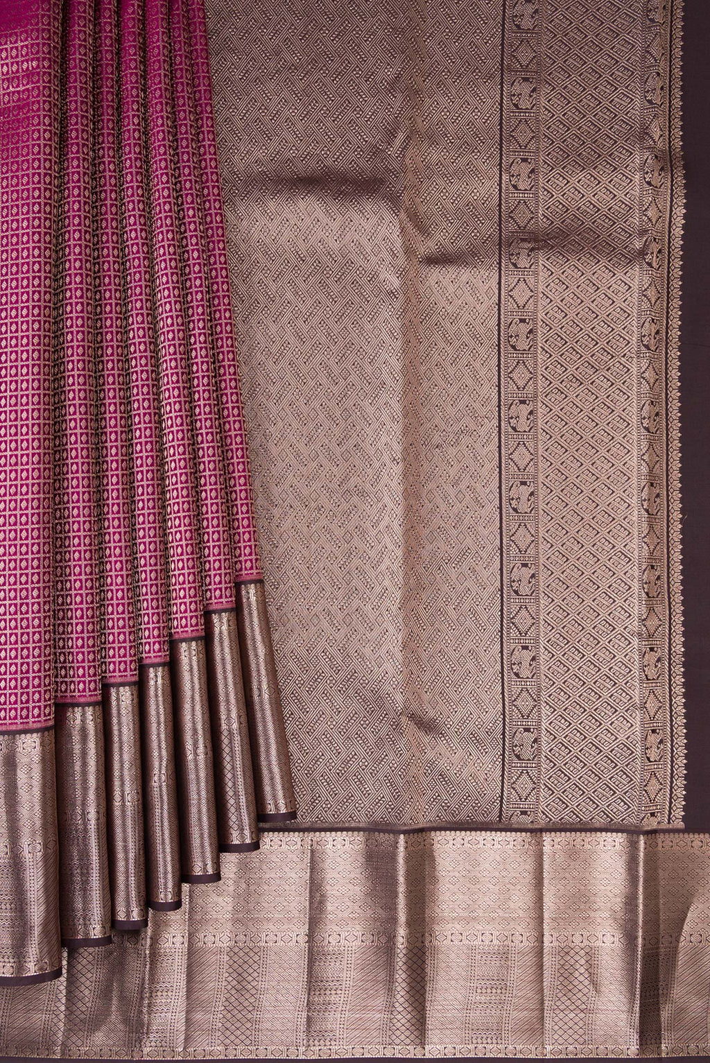 Pleats and pallu of Magenta Kanchipuram Silk Saree with Zari Brocade on the body and Zari Border. 