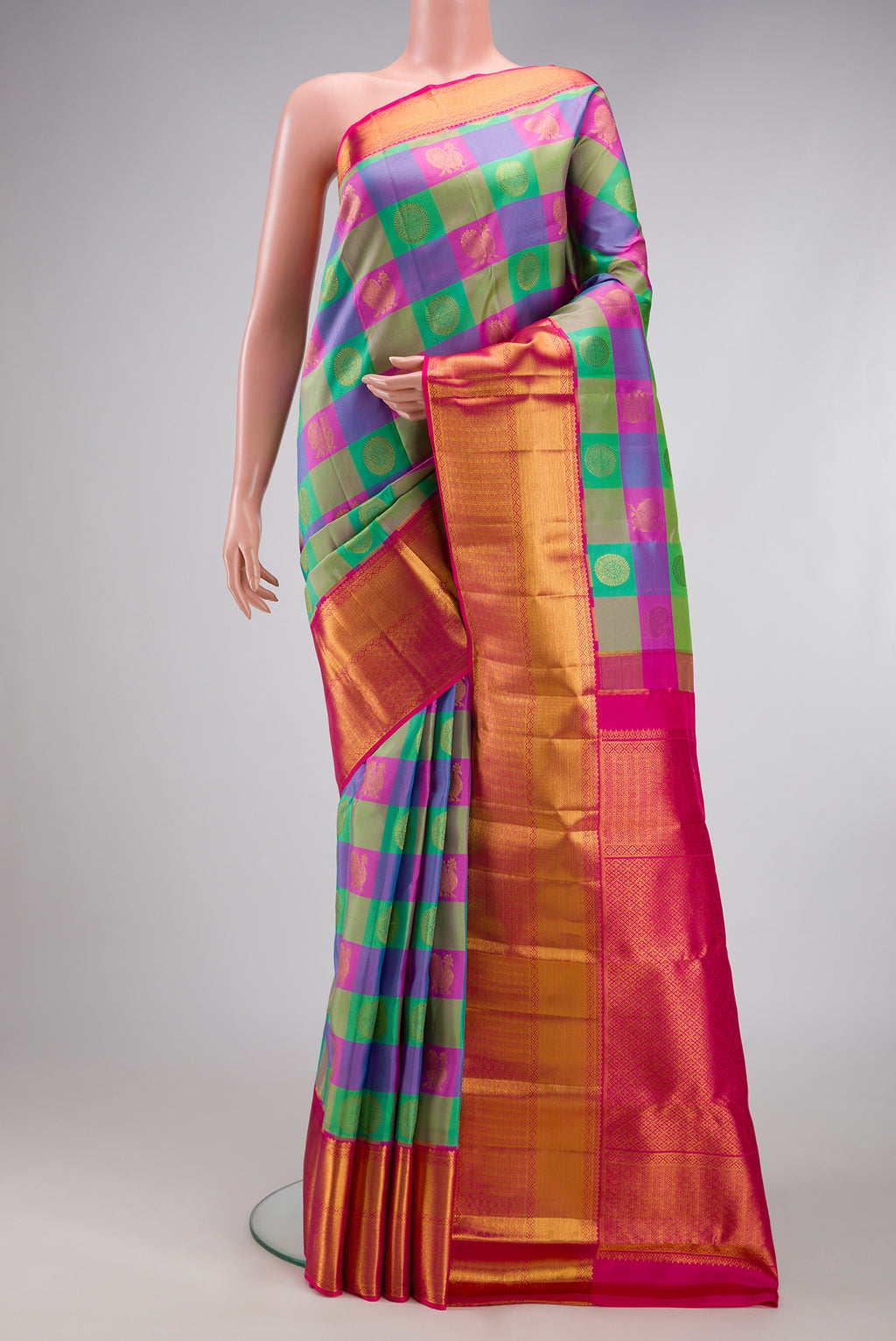 Multi Color Kanchipuram Silk Saree with Checked design on the body and Zari Border.  displayed on a mannequin