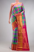 Multi Color Kanchipuram Silk Saree with Checked design on the body and Zari Border.  displayed on a mannequin