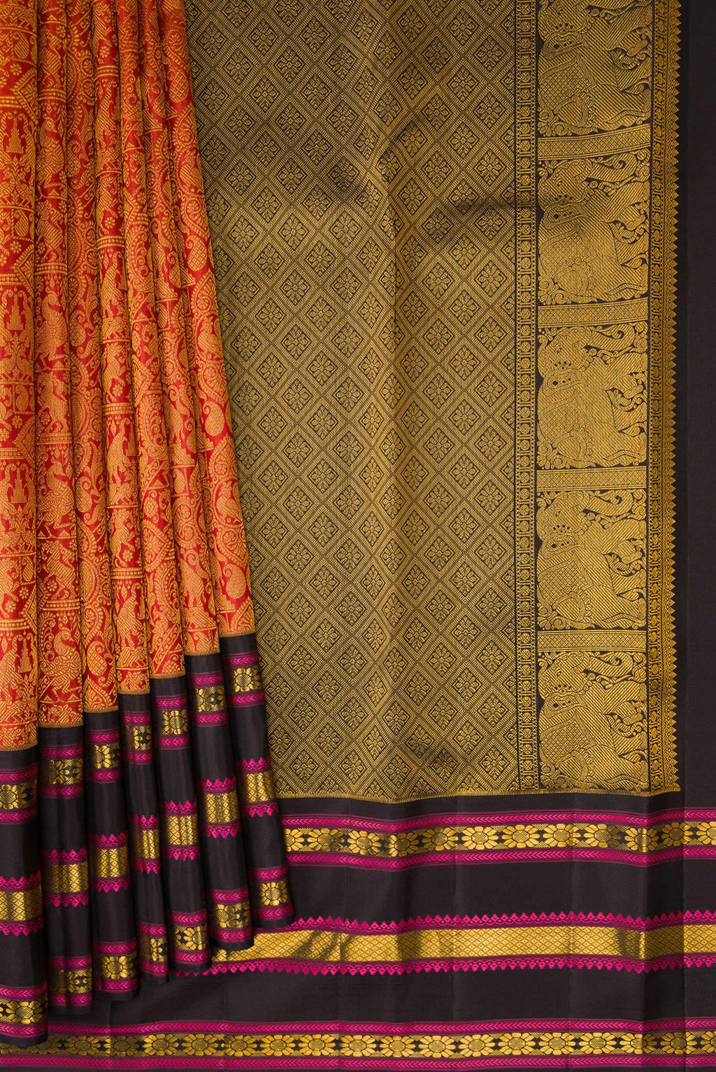 Pleats and pallu of Brick Orange Dual Tone Kanchipuram Silk Saree with Zari Brocade on the body and Zari And Thread Border. 