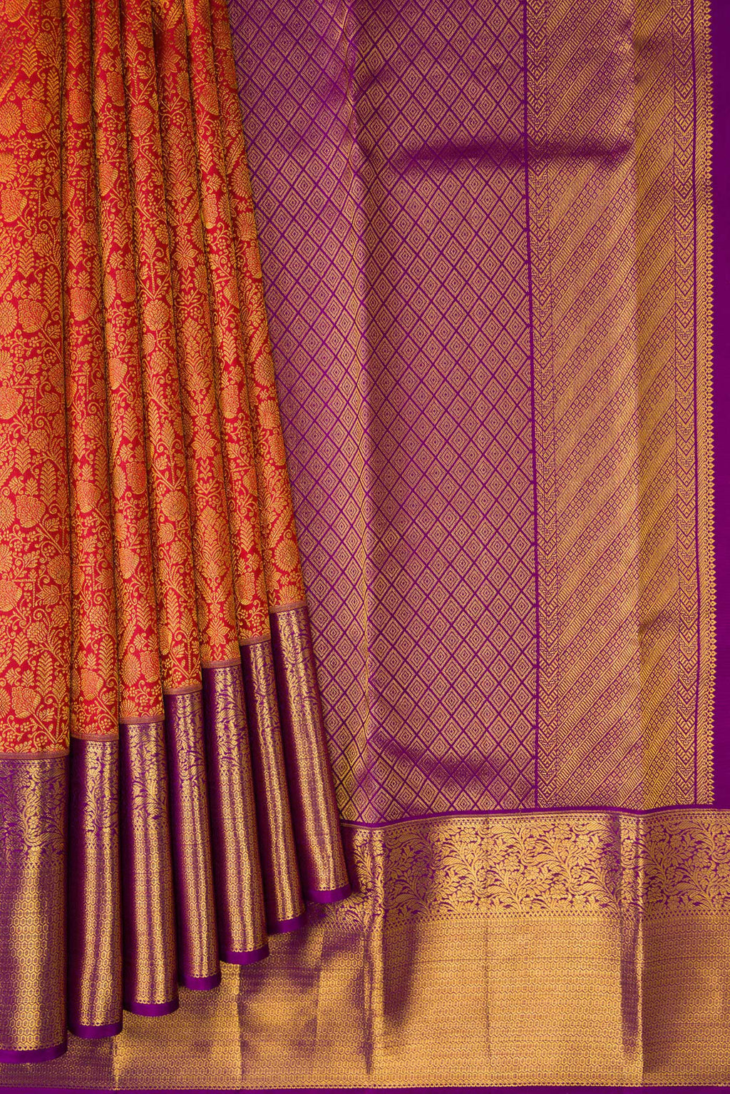 Pleats and pallu of Brick Orange Kanchipuram Silk Saree with Zari Brocade on the body and Zari Border. 
