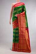 Green Kanchipuram Silk Saree with Zari Brocade on the body and Zari Border.  displayed on a mannequin