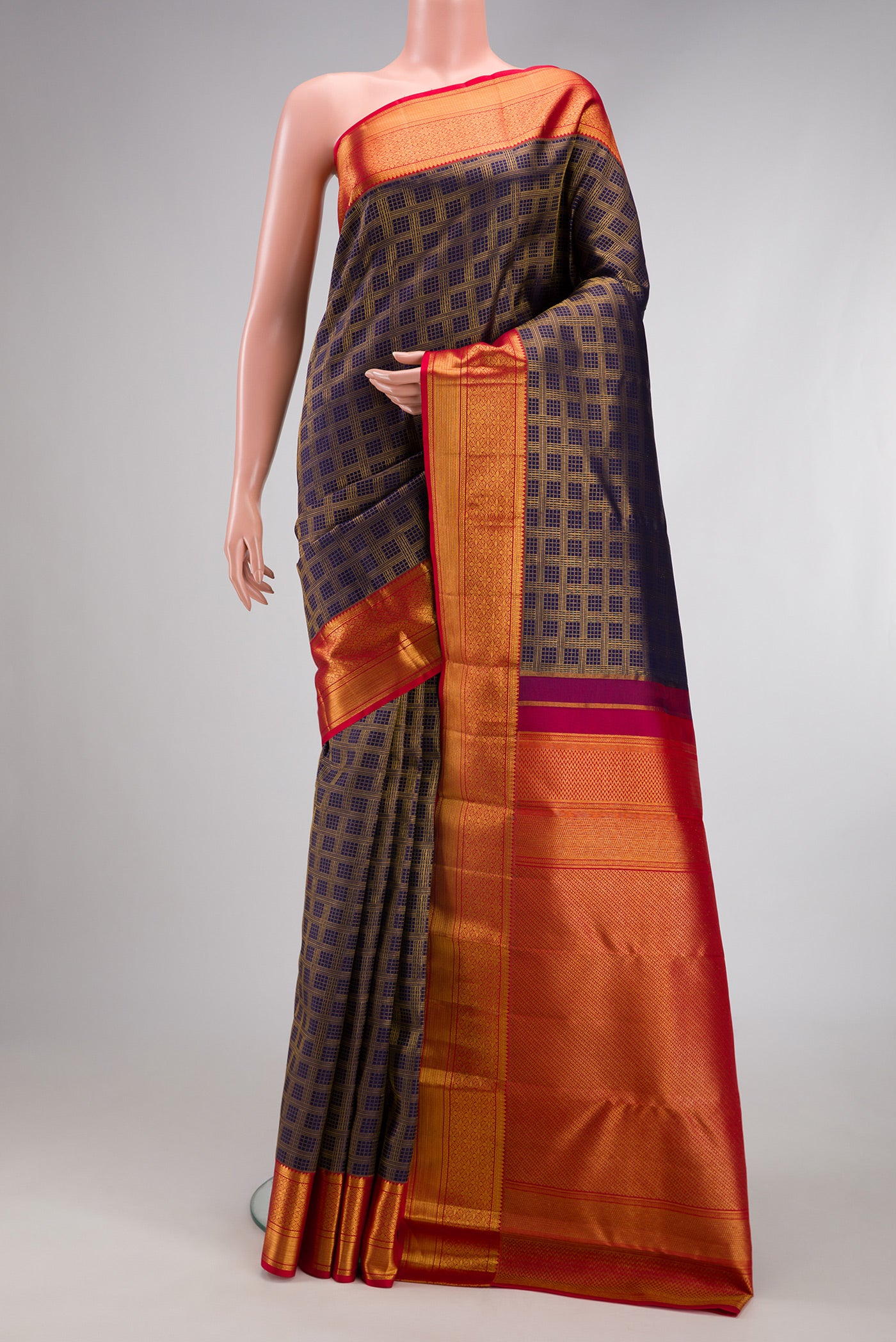 Navy Blue Kanchipuram Silk Saree with Zari Brocade on the body and Zari Border.  displayed on a mannequin