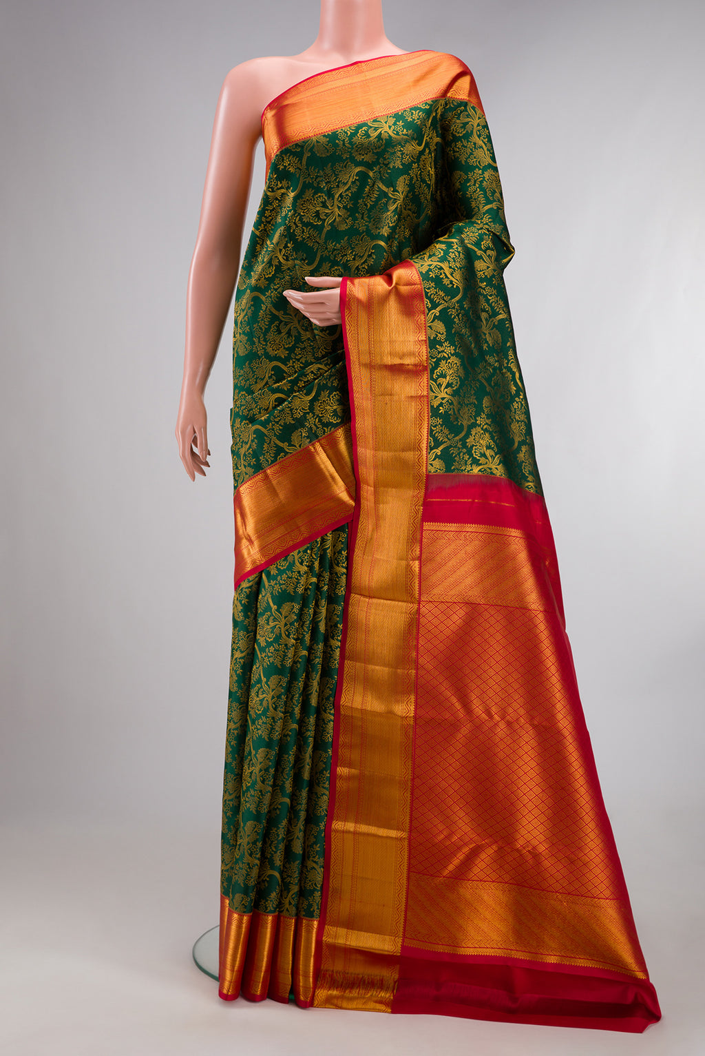 Pure Silk Bottle Green Kanchipuram Saree with Zari Brocade on the body and Zari Border.  displayed on a mannequin