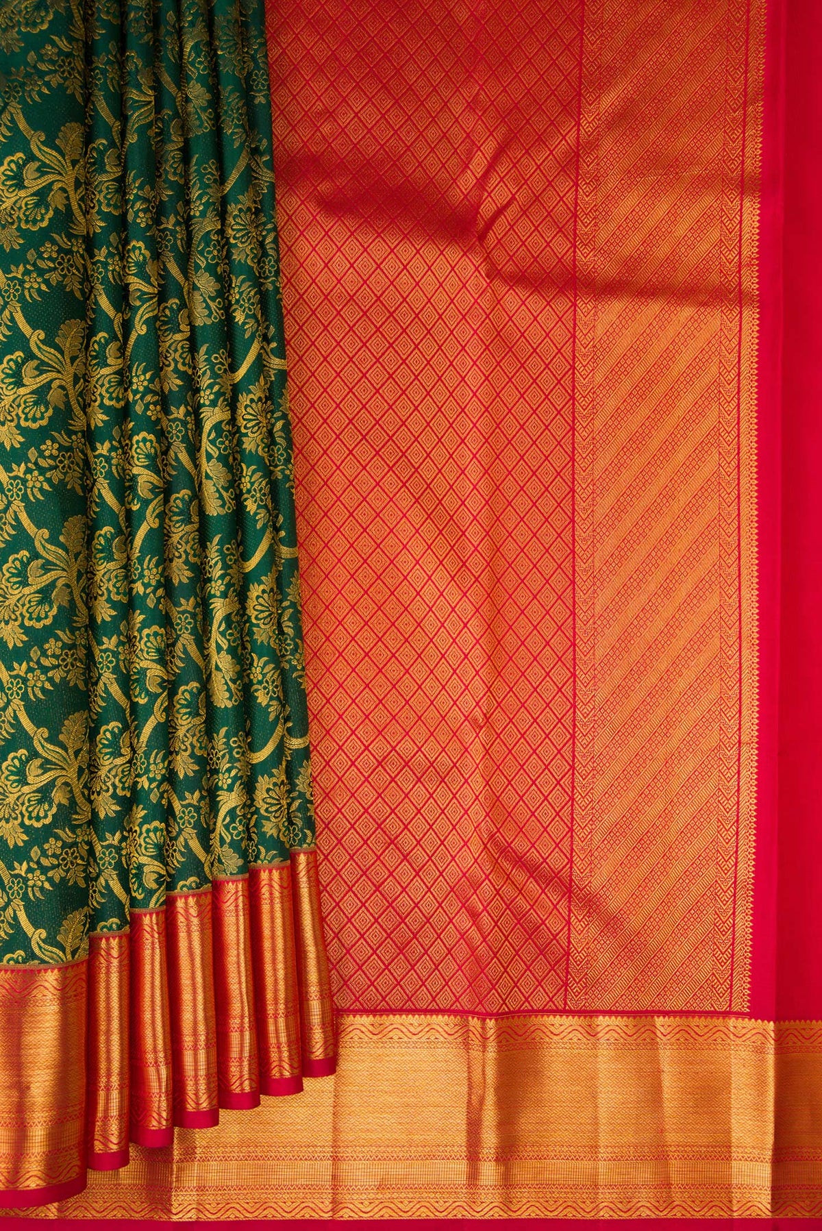 Pleats and pallu of Pure Silk Bottle Green Kanchipuram Saree with Zari Brocade on the body and Zari Border. 