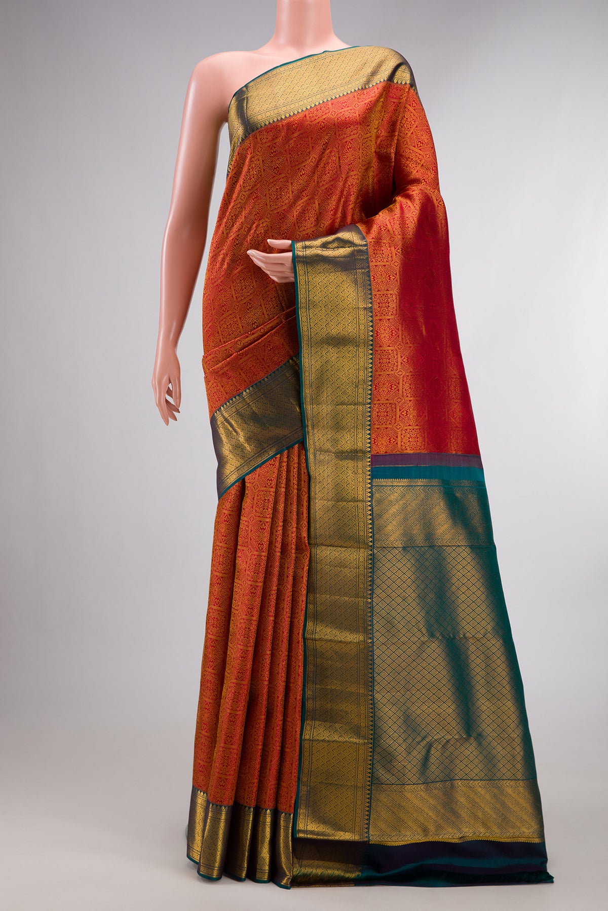 Pure Silk Red Kanchipuram Saree with Zari Brocade on the body and Zari Border.  displayed on a mannequin