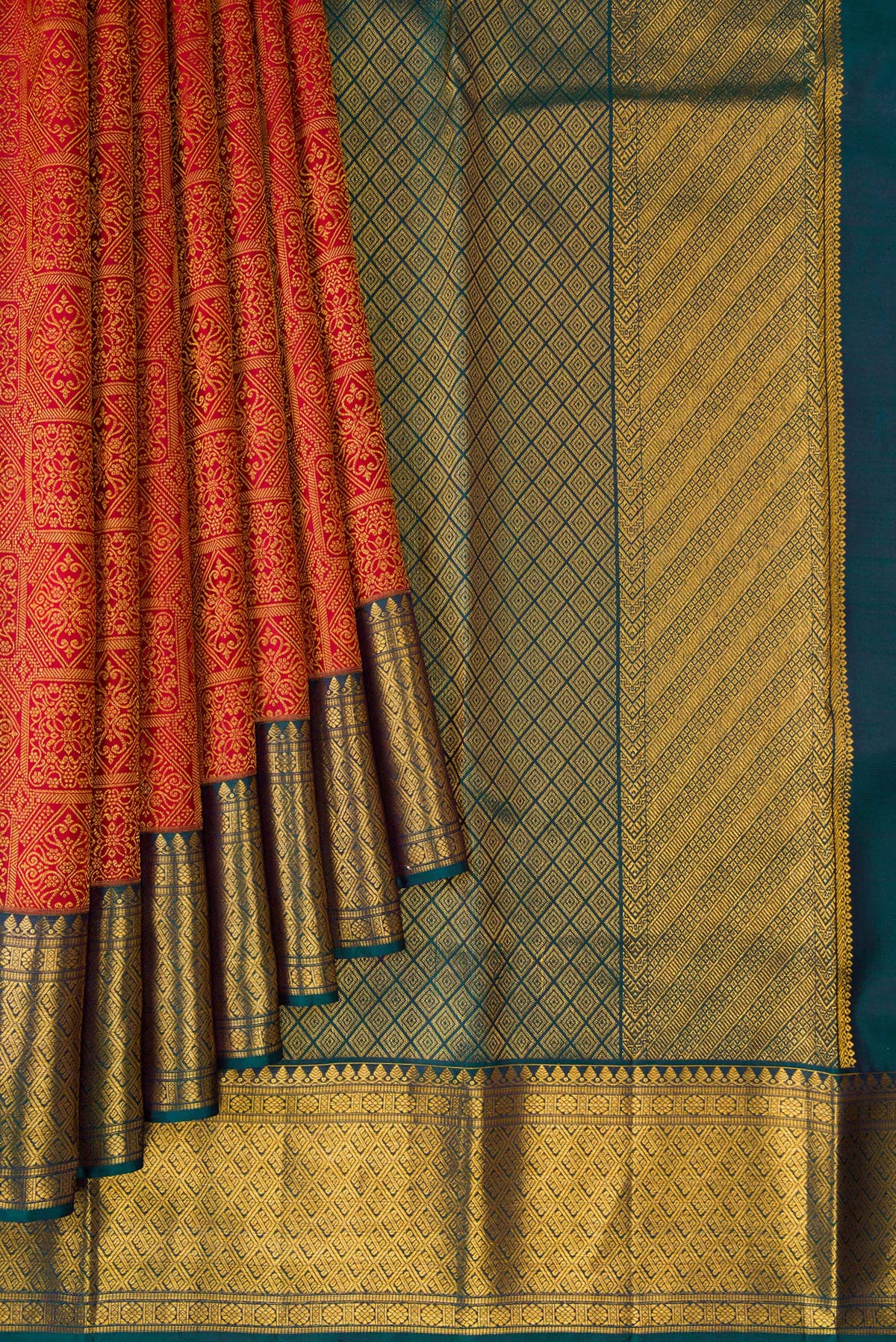 Pleats and pallu of Pure Silk Red Kanchipuram Saree with Zari Brocade on the body and Zari Border. 