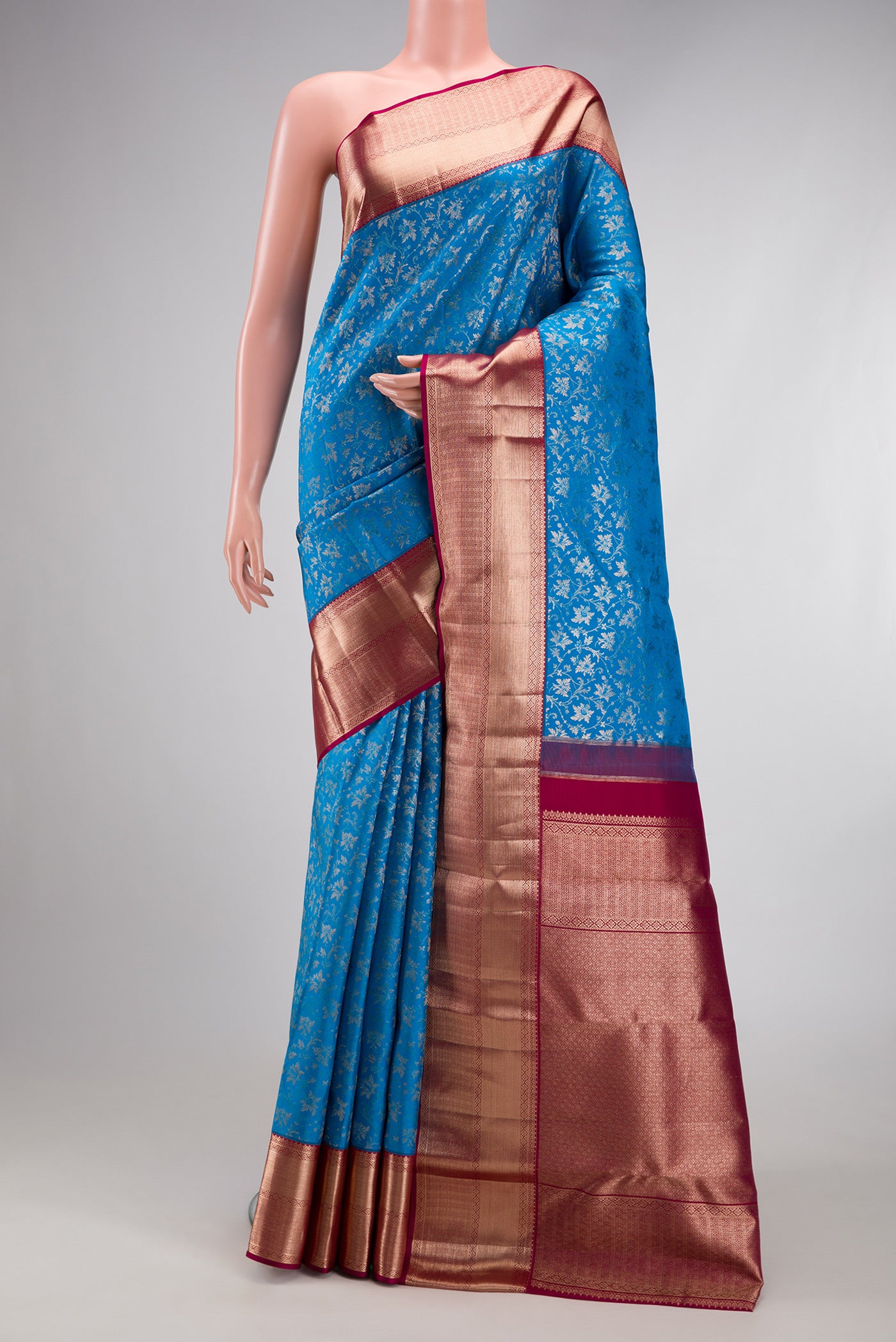 Blue Kanchipuram Silk Saree with Zari Brocade on the body and Zari Border.  displayed on a mannequin