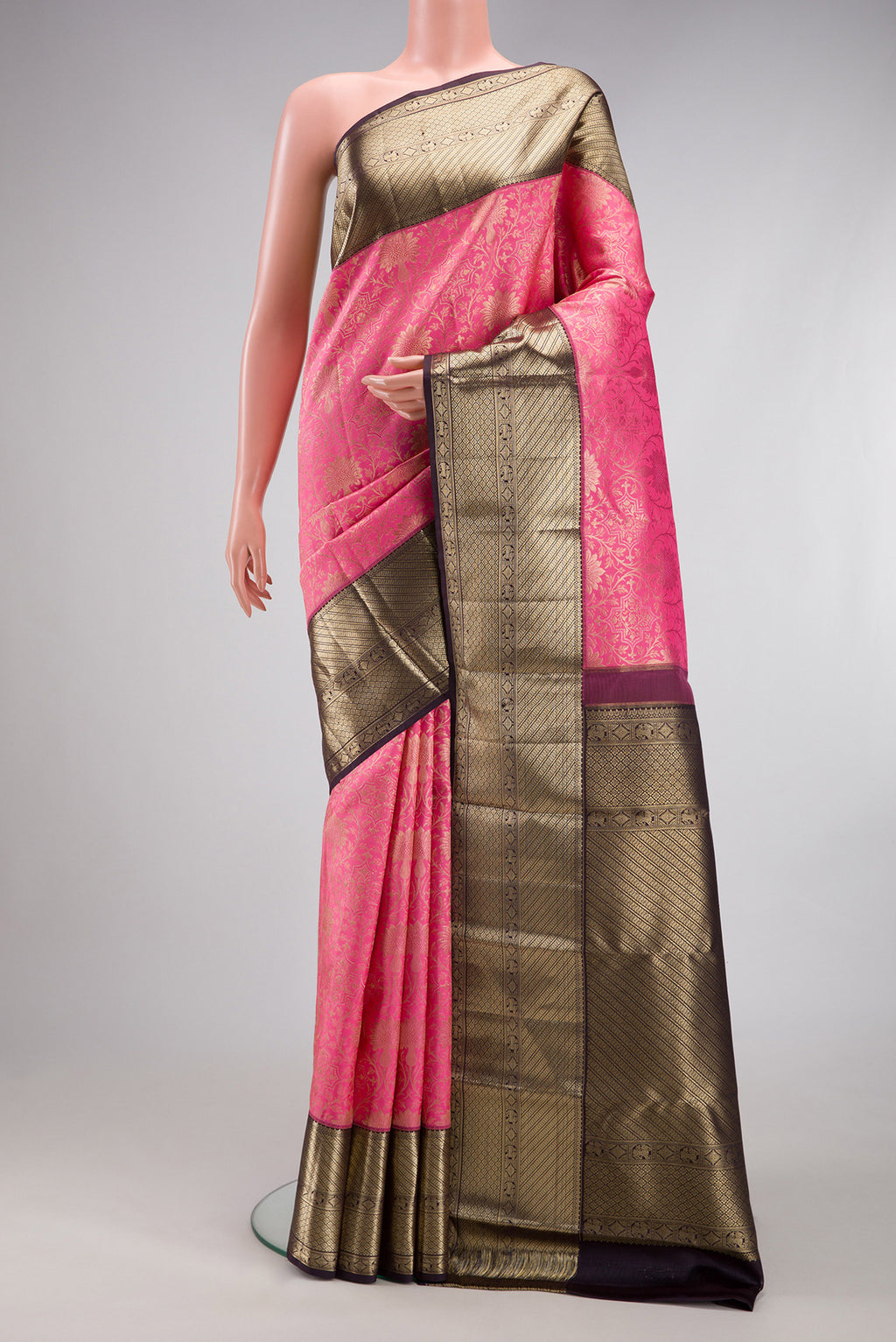 Pink Kanchipuram Silk Saree with Zari Brocade on the body and Zari Border.  displayed on a mannequin