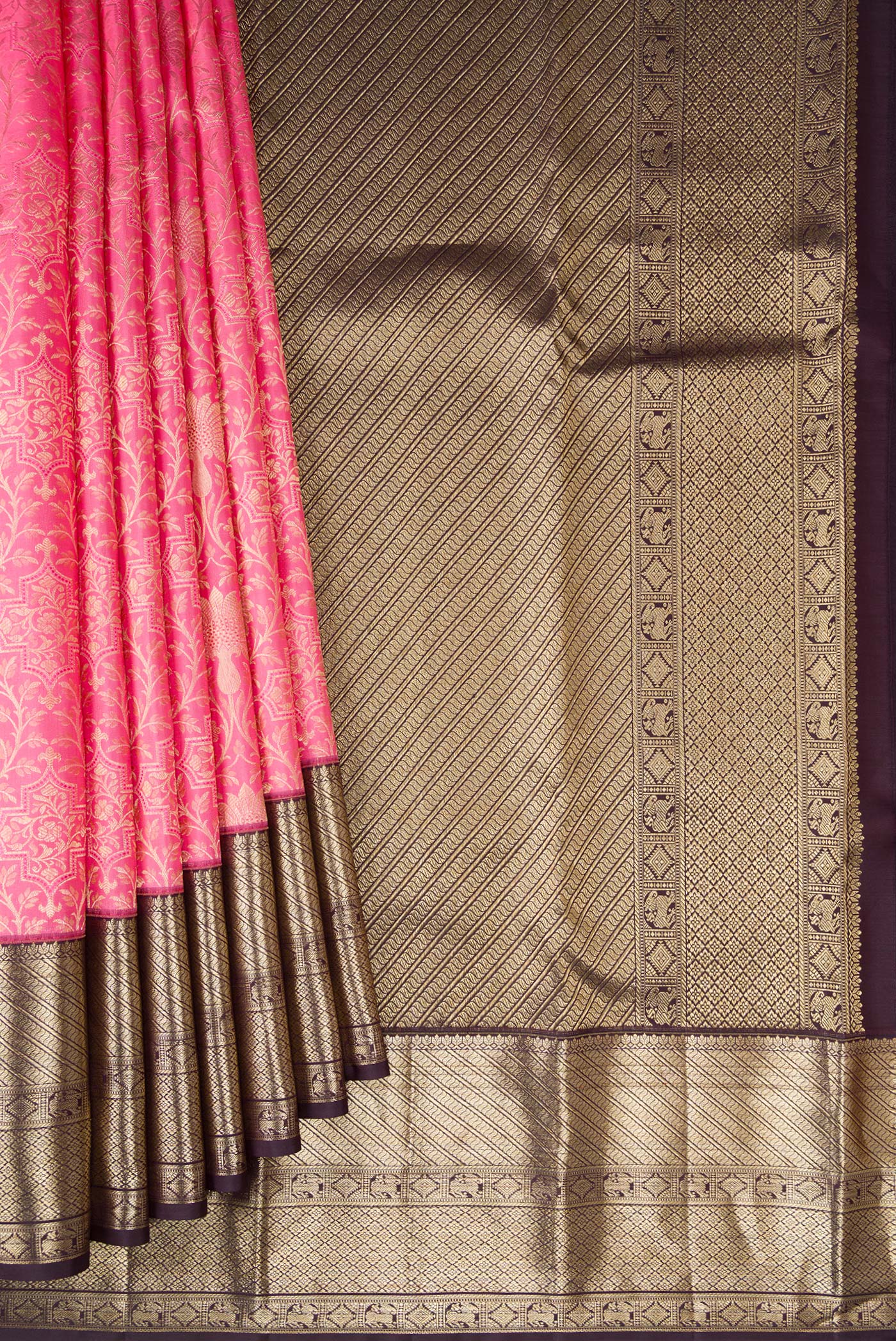 Pleats and pallu of Pink Kanchipuram Silk Saree with Zari Brocade on the body and Zari Border. 