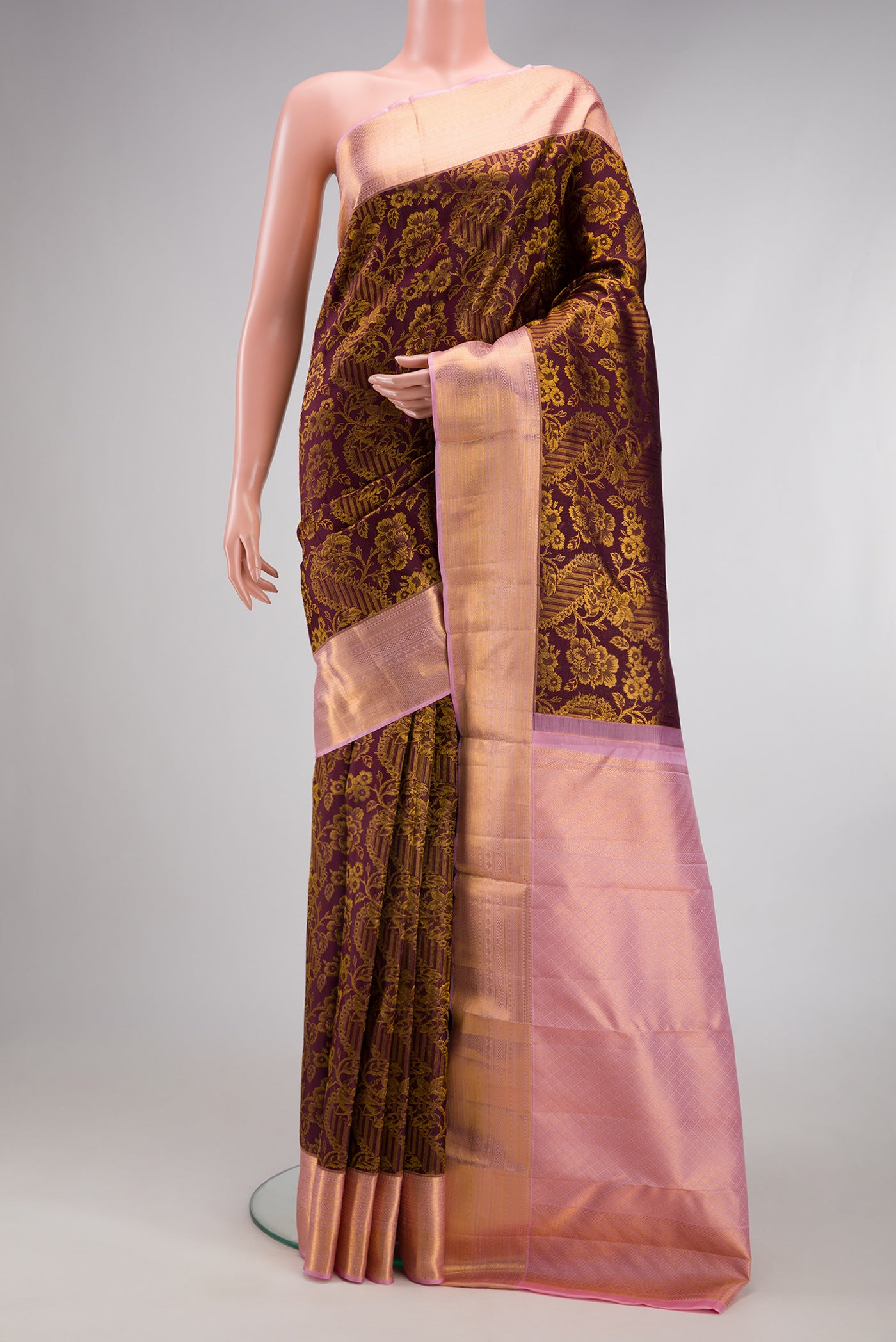 Coffee Brown Kanchipuram Silk Saree with Zari Brocade on the body and Zari Border.  displayed on a mannequin