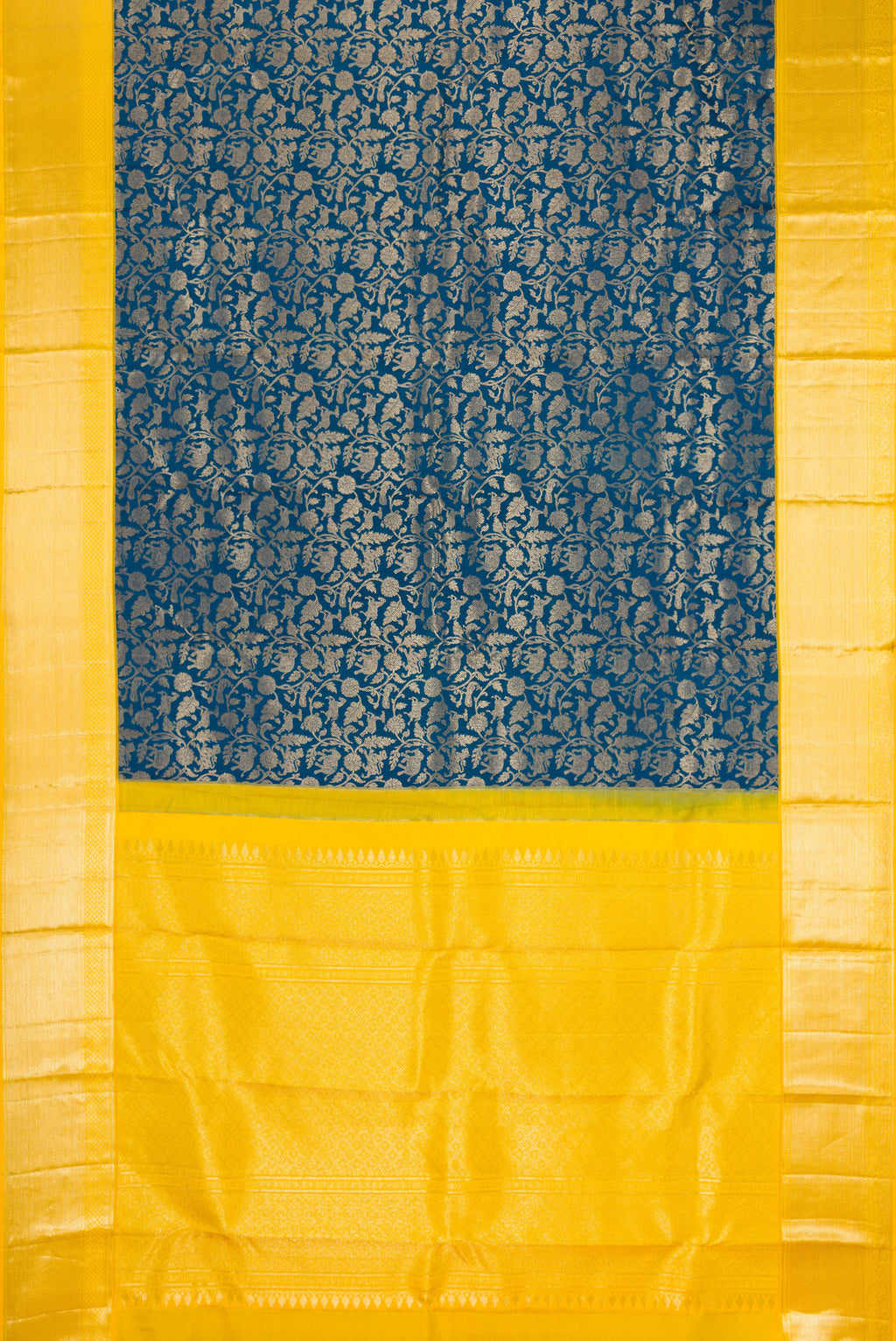 Flat view of Peacock Blue Kanchipuram Silk Saree with Zari Brocade on the body and Zari Border. 