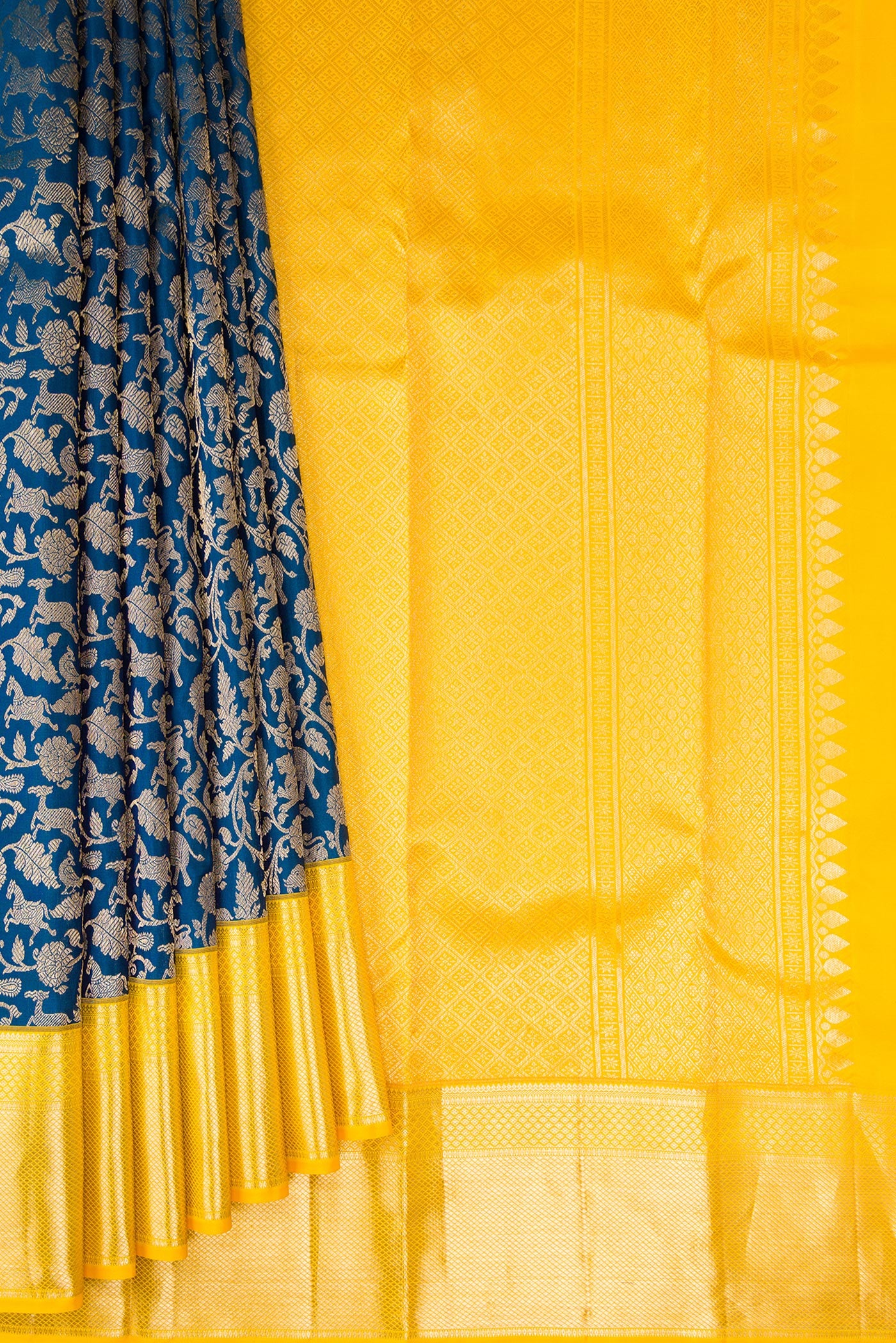 Pleats and pallu of Peacock Blue Kanchipuram Silk Saree with Zari Brocade on the body and Zari Border. 