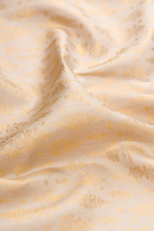 Close up of Beige Kanchipuram Silk Saree with Zari Brocade on the body and Zari Border.  displaying folds