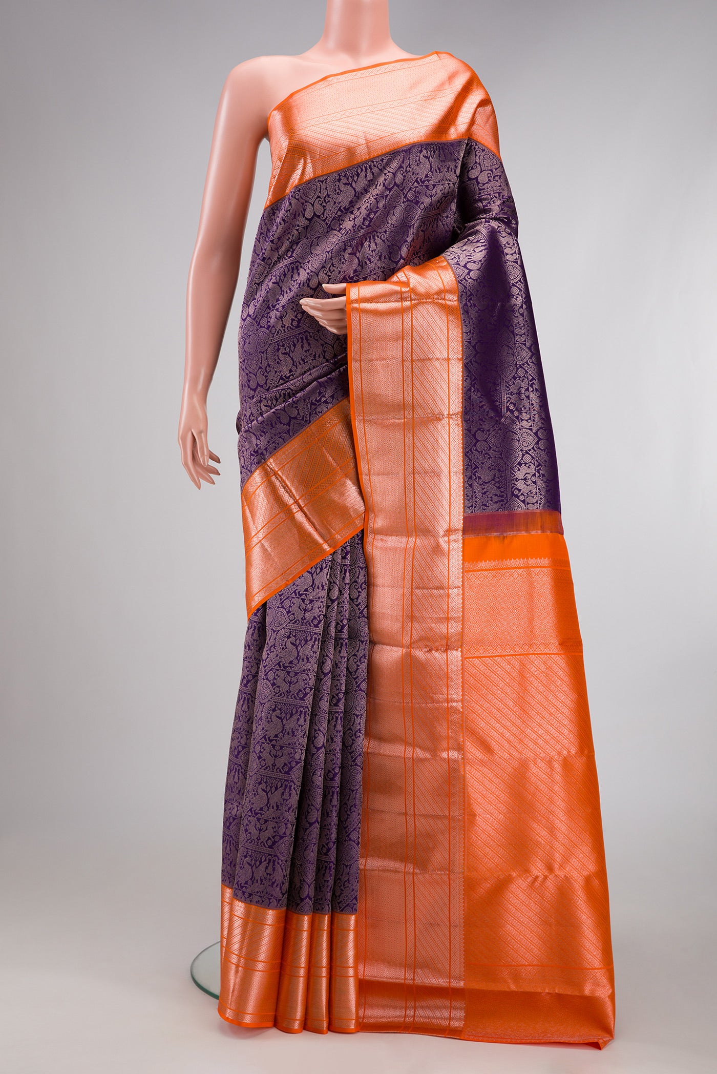 Navy Blue Kanchipuram Silk Saree with Zari Brocade on the body and Zari Border.  displayed on a mannequin
