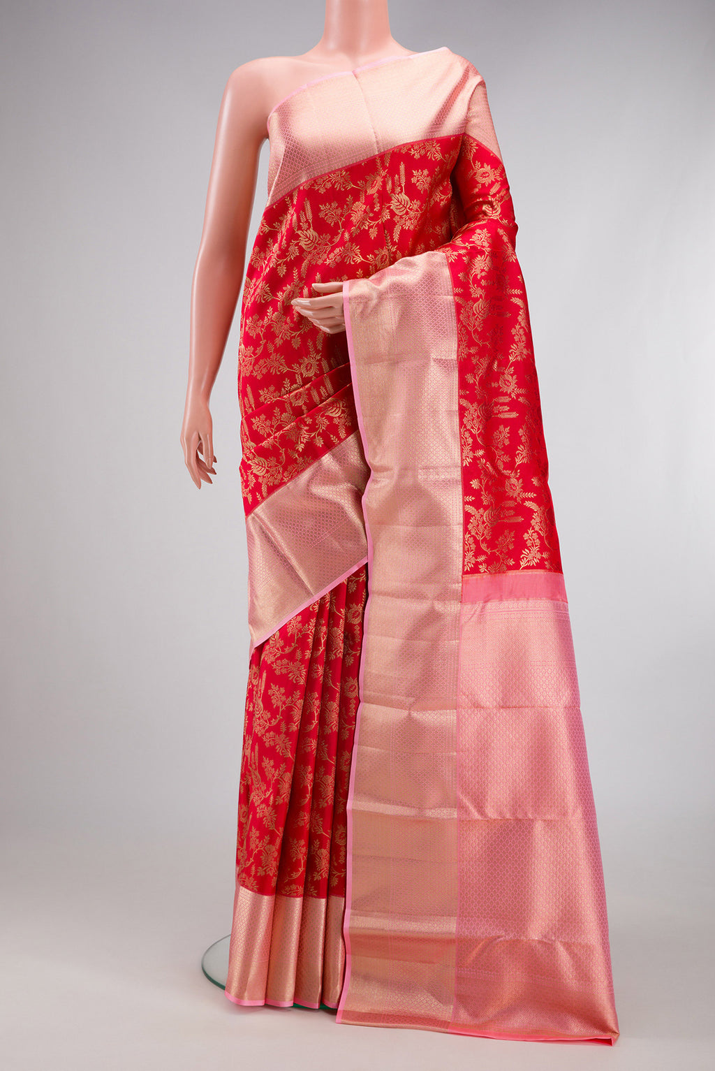 Red Kanchipuram Silk Saree with Zari Brocade on the body and Zari Border.  displayed on a mannequin