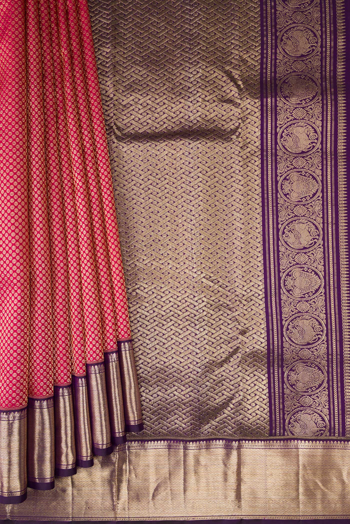 Pleats and pallu of Rani Pink Kanchipuram Silk Saree with Zari Brocade on the body and Zari Border. 