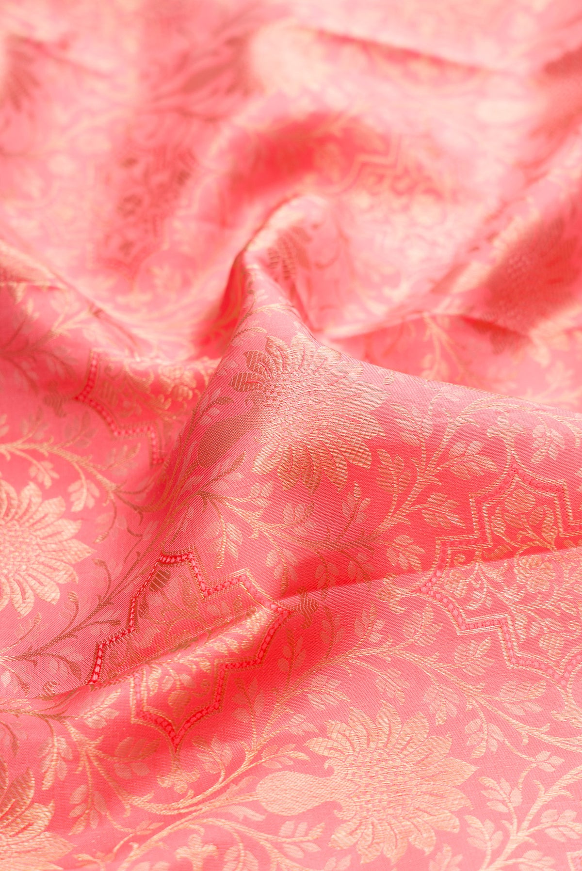 Close up of Pink Dual Tone Kanchipuram Silk Saree with Zari Brocade on the body and Fancy Border.  displaying folds