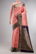 Pure Silk Peach Kanjivaram Saree with Zari Brocade on the body and Zari Border.  displayed on a mannequin