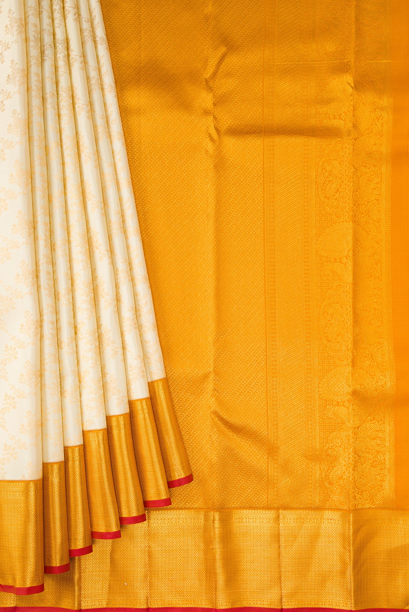 Pleats and pallu of Off White Kanjivaram Silk Saree with Zari Brocade on the body and Zari Border. 