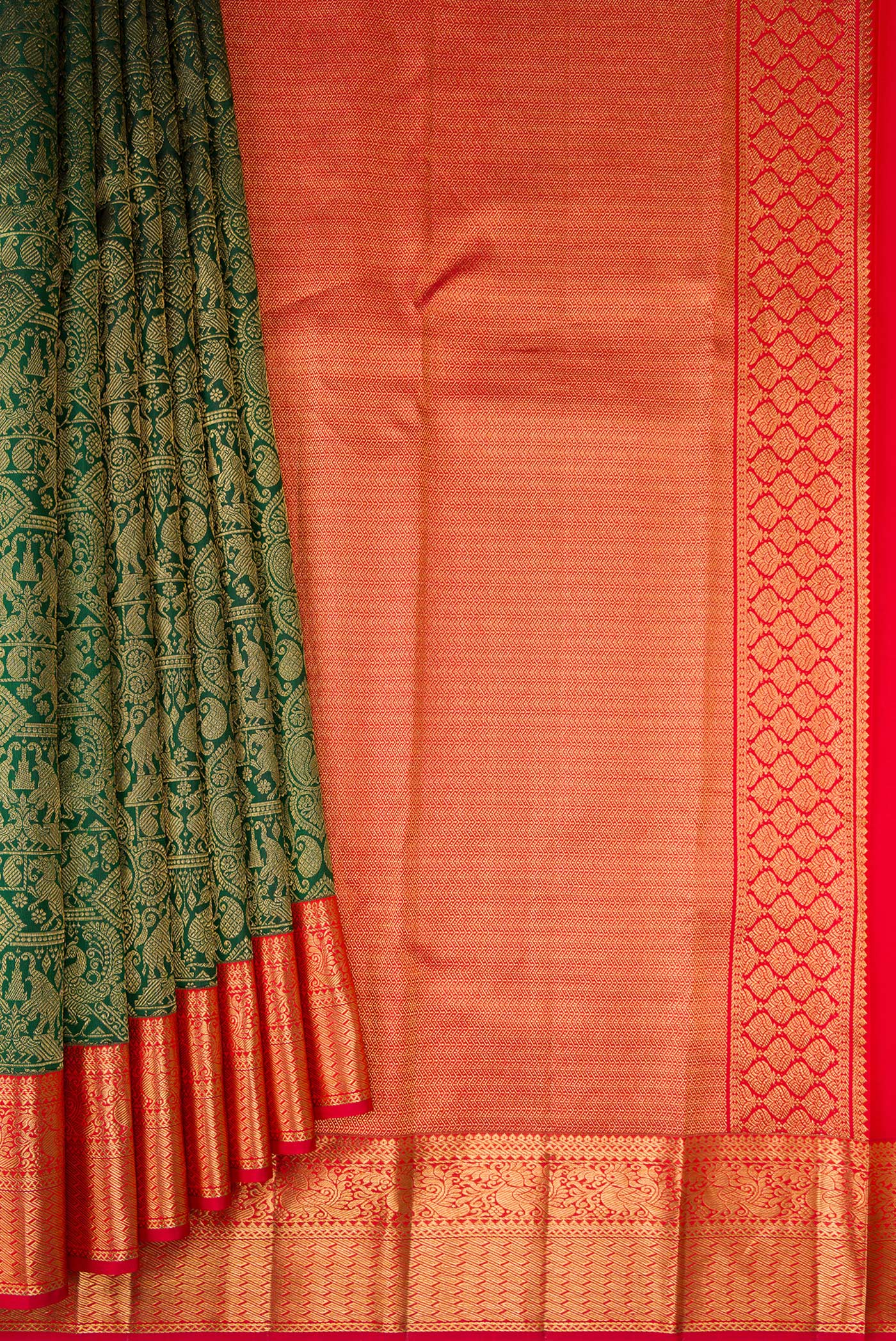 Pleats and pallu of Bottle Green Kanjivaram Silk Saree with Zari Brocade on the body and Zari Border. 