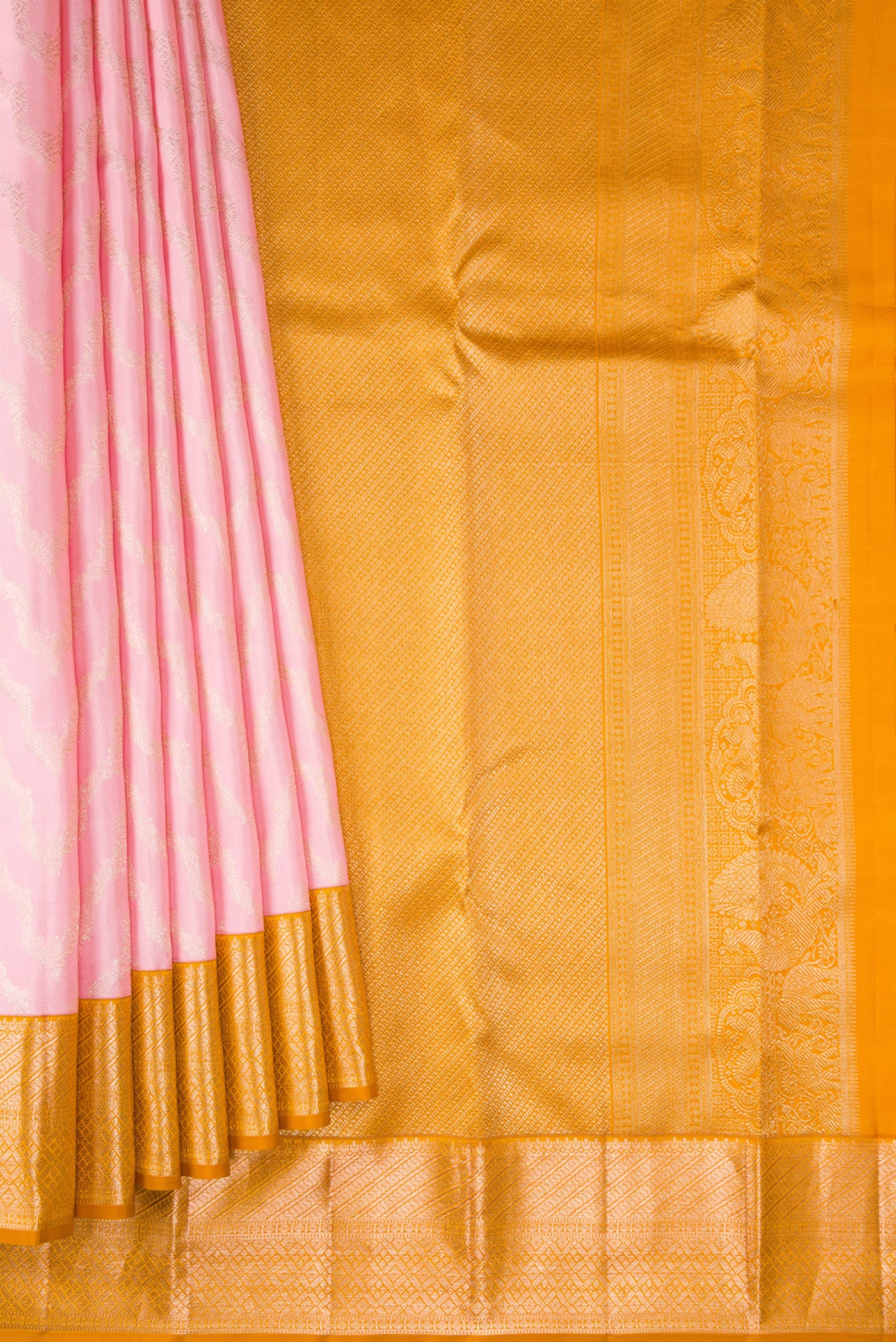 Pleats and pallu of Rose pink Kanjivaram Silk Saree with Zari Brocade on the body and Zari Border. 