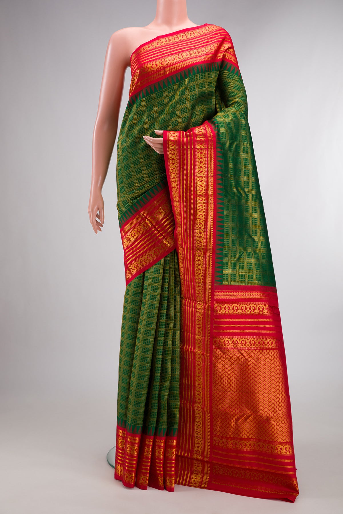 Pure Silk Green Kanjivaram Saree with Zari Brocade on the body and Fancy Border.  displayed on a mannequin