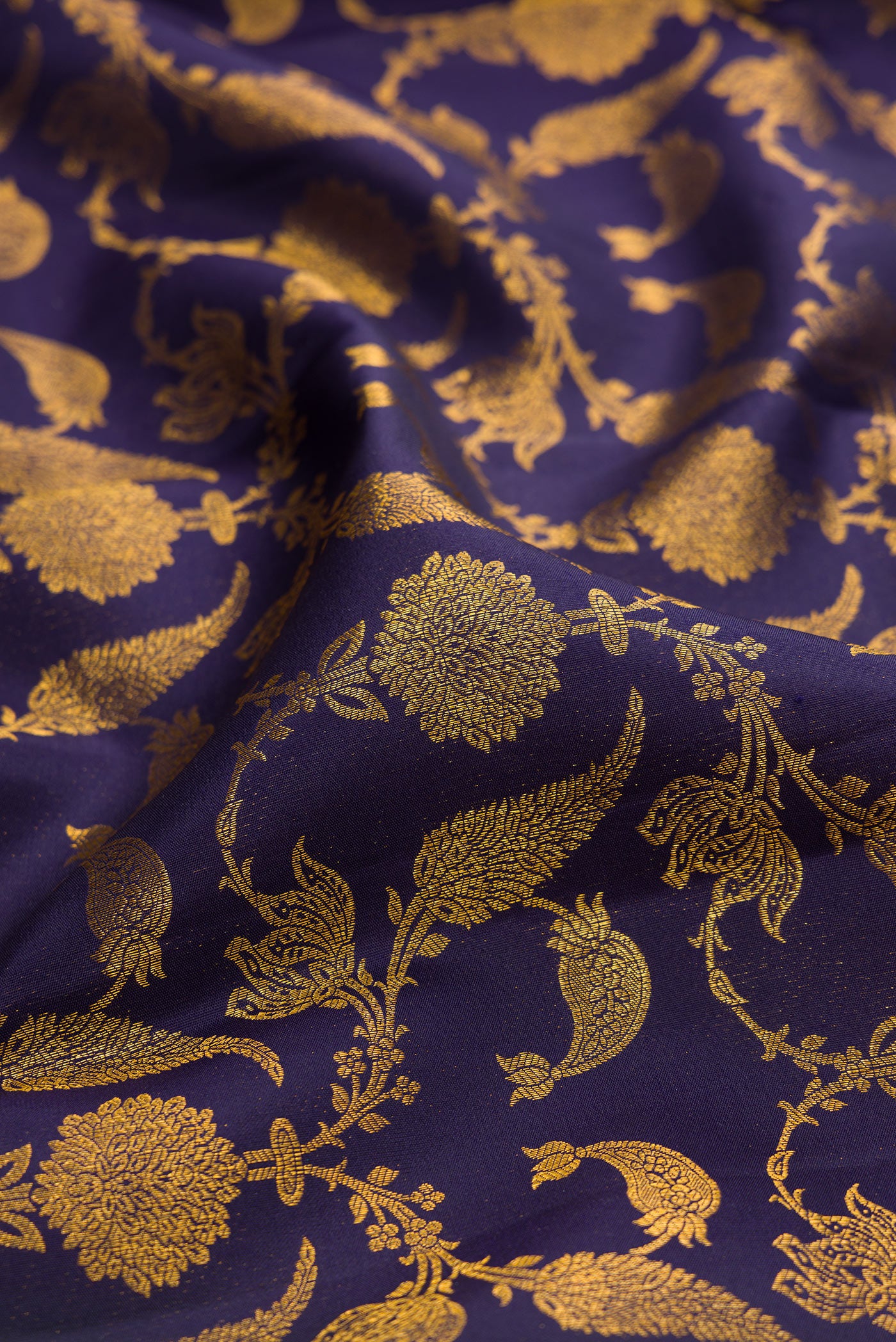 Close up of Navy Blue Kanjivaram Silk Saree with Zari Brocade on the body and Zari Border.  displaying folds