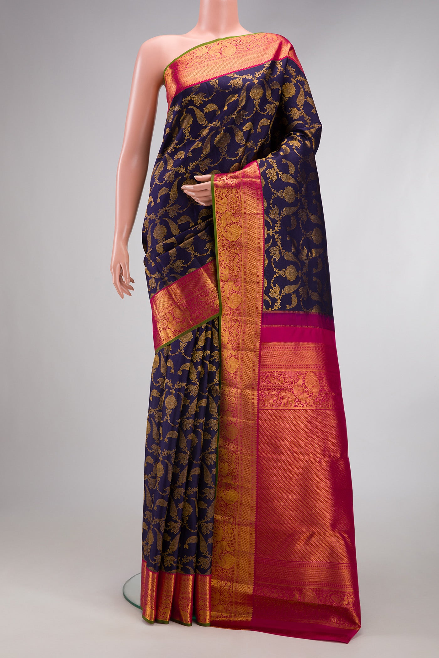 Navy Blue Kanjivaram Silk Saree with Zari Brocade on the body and Zari Border.  displayed on a mannequin