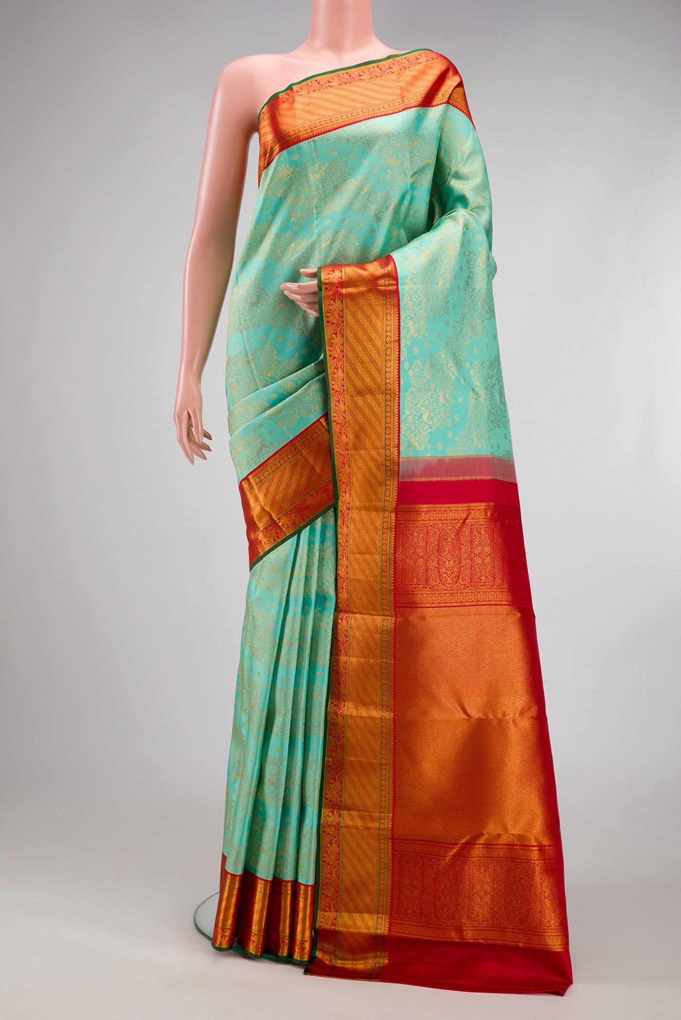 Sea Green Kanjivaram Silk Saree with Zari Brocade on the body and Zari Border.  displayed on a mannequin