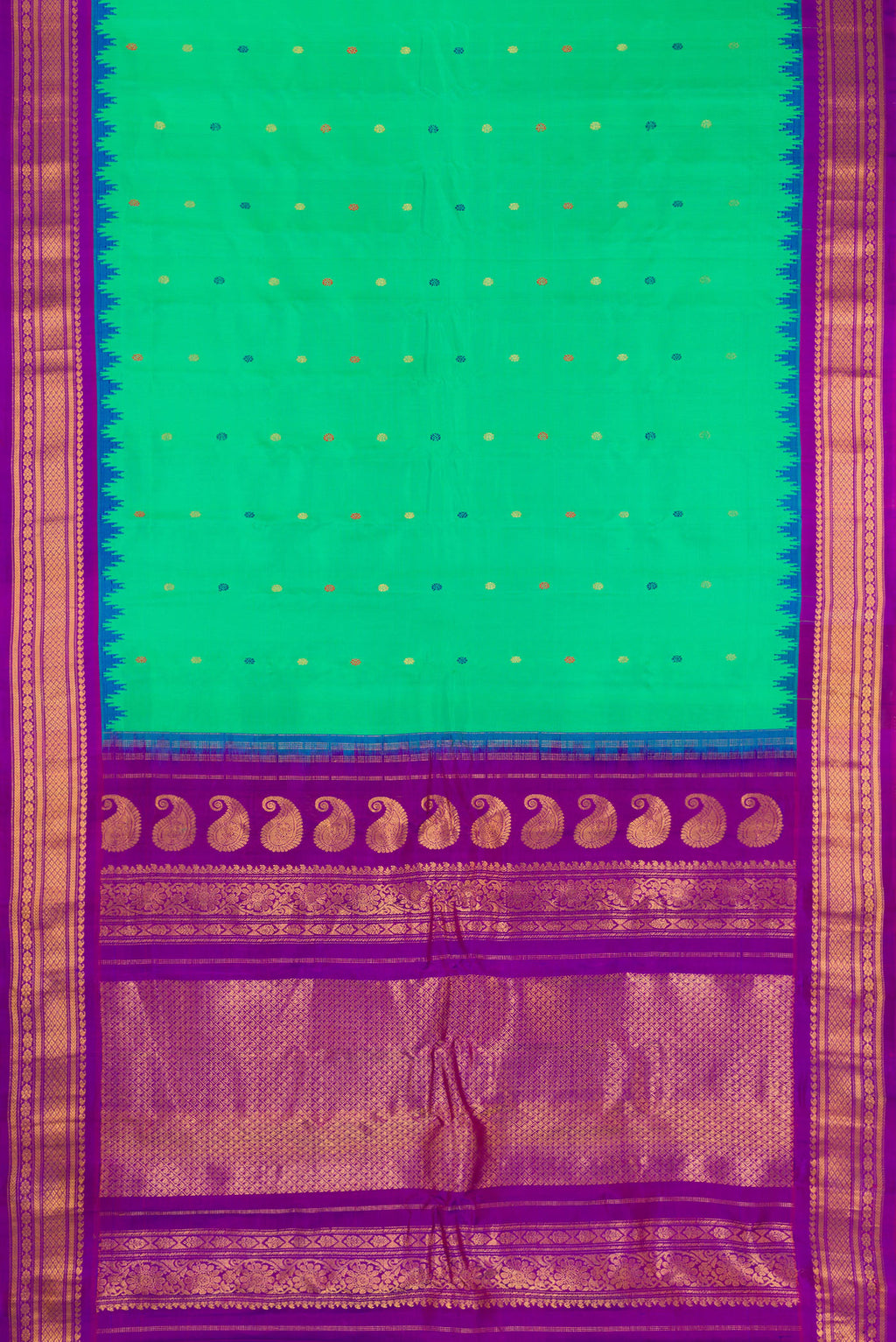 Flat view of Green Gadwal Silk Saree with Thread Butta on the body and Zari Border. 
