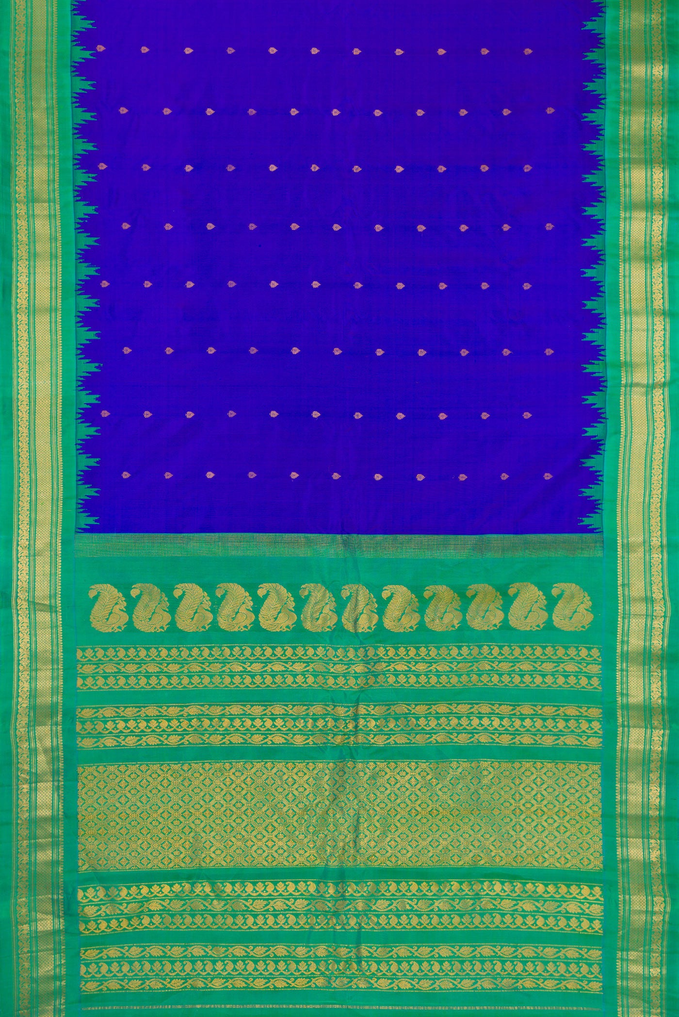 Flat view of Royal Blue Gadwal Silk Saree with Zari Butta on the body and Temple Border. 