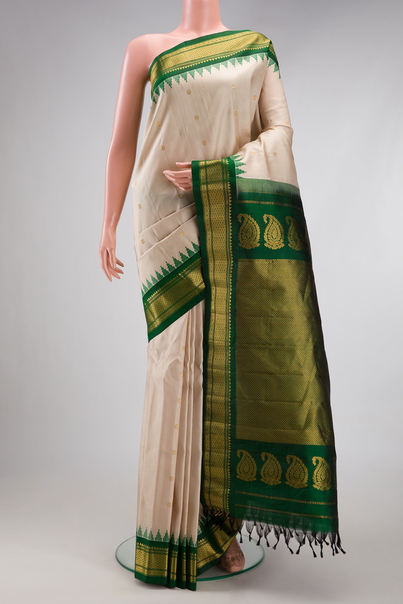 Beige Gadwal Silk Saree with Zari Butta on the body and Zari Border.  displayed on a mannequin