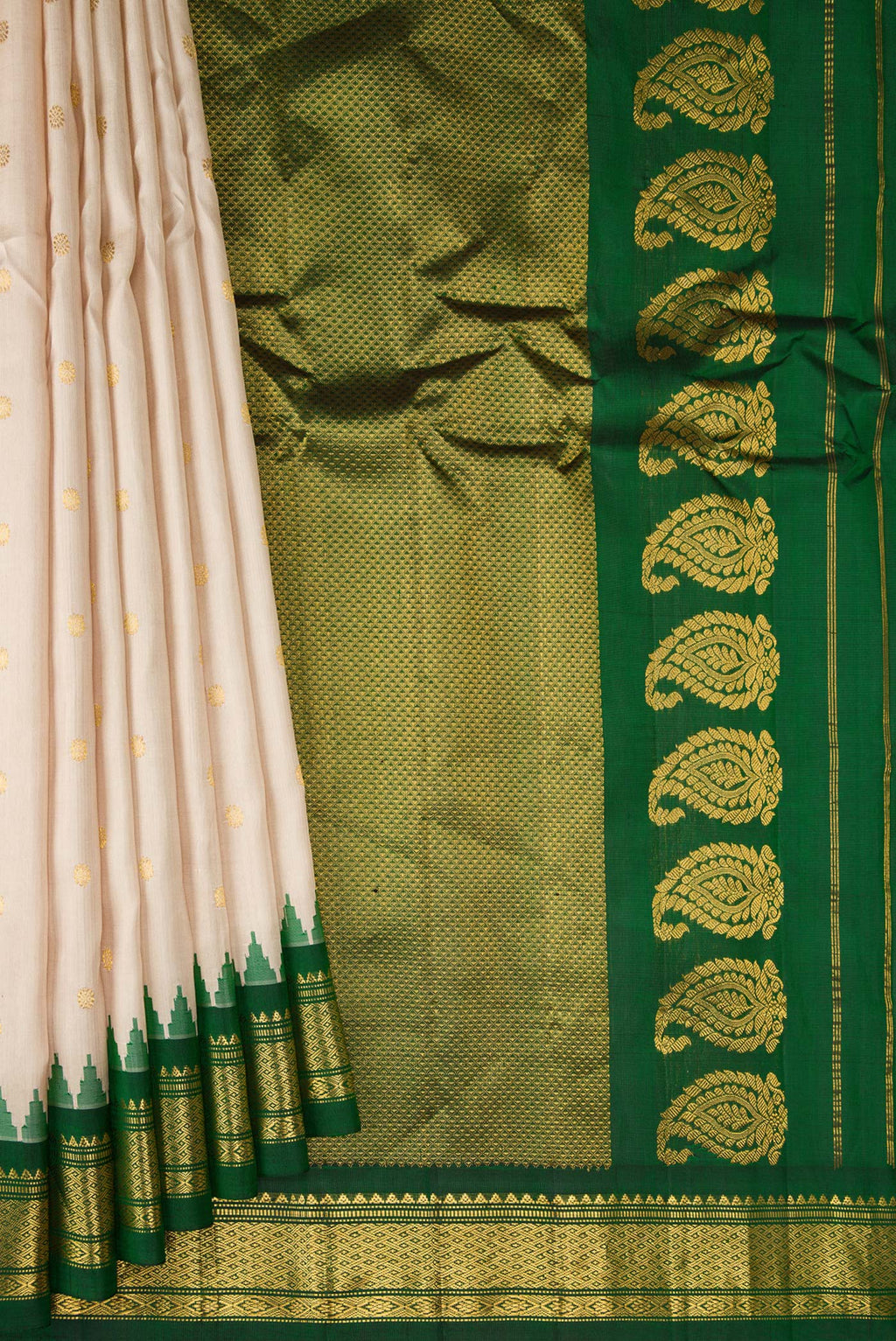 Pleats and pallu of Beige Gadwal Silk Saree with Zari Butta on the body and Zari Border. 